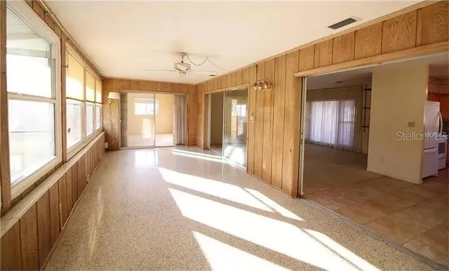 a view of a hallway with windows