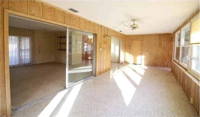 a view of a yard with potted plants