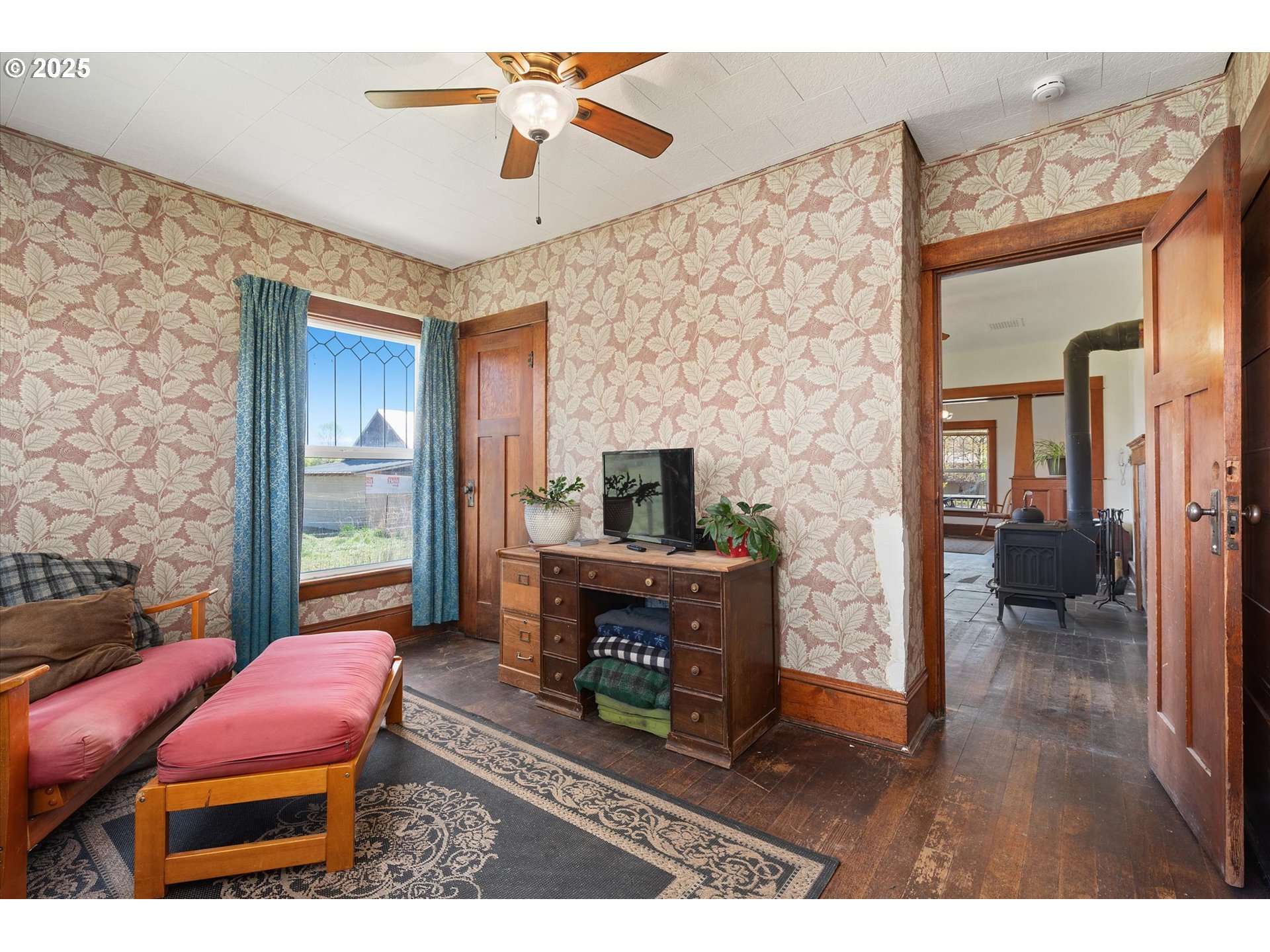 37867 Highway 414 Halfway Or 97834 Halfway, OR 97834 - Photo 14 of 48 a living room with furniture a flat screen tv and a fireplace