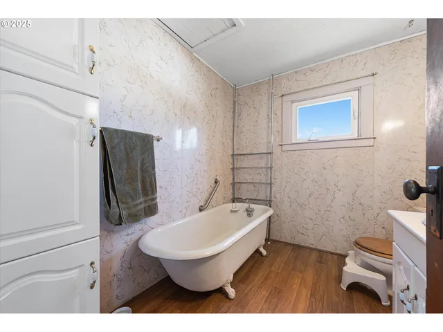 a bathroom with a toilet a sink and bathtub
