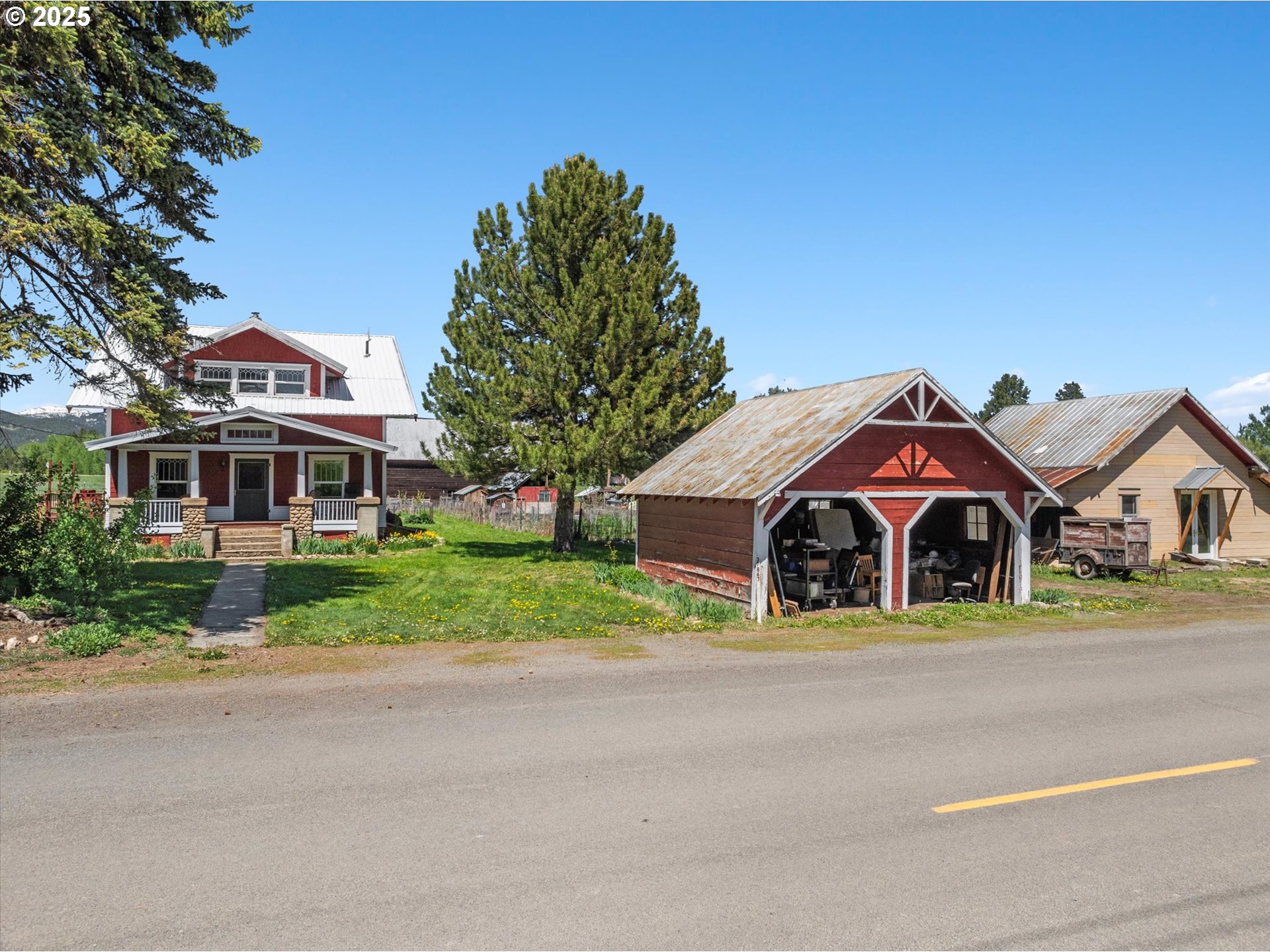 37867 Highway 414 Halfway Or 97834 Halfway, OR 97834 - Photo 2 of 48 a front view of a house with a yard and garage