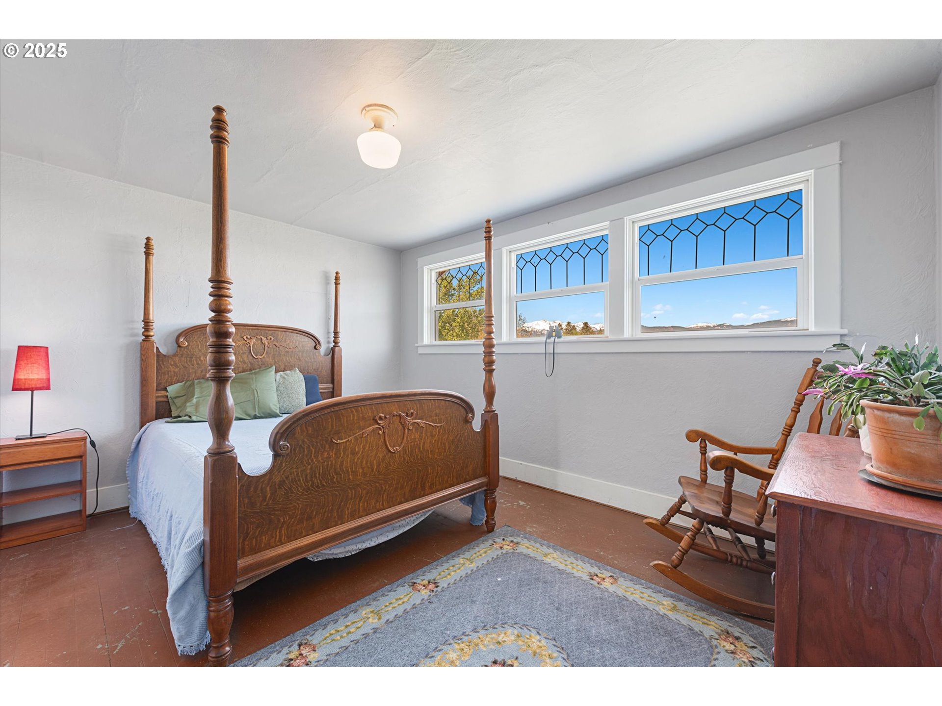 37867 Highway 414 Halfway Or 97834 Halfway, OR 97834 - Photo 24 of 48 a bedroom with furniture and a wooden floor