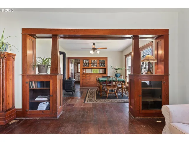 a living room view with furniture and a potted plant