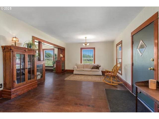 a living room with furniture and a table