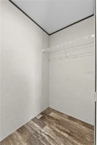 a view of a room with shelf on the wall