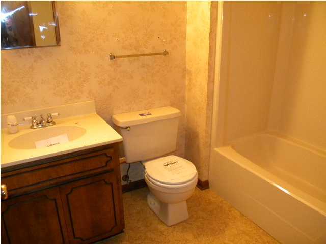 5260 Keyser Mill Road Baker, FL 32531 - Photo 11 of 17 a bathroom with a sink and a toilet