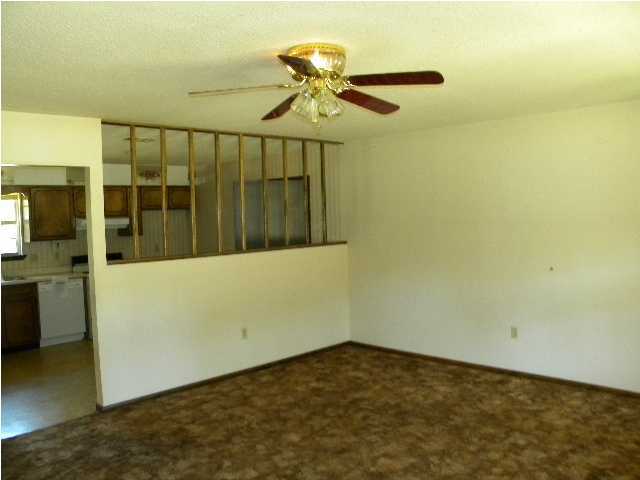 5260 Keyser Mill Road Baker, FL 32531 - Photo 3 of 17 a view of a room with a ceiling fan