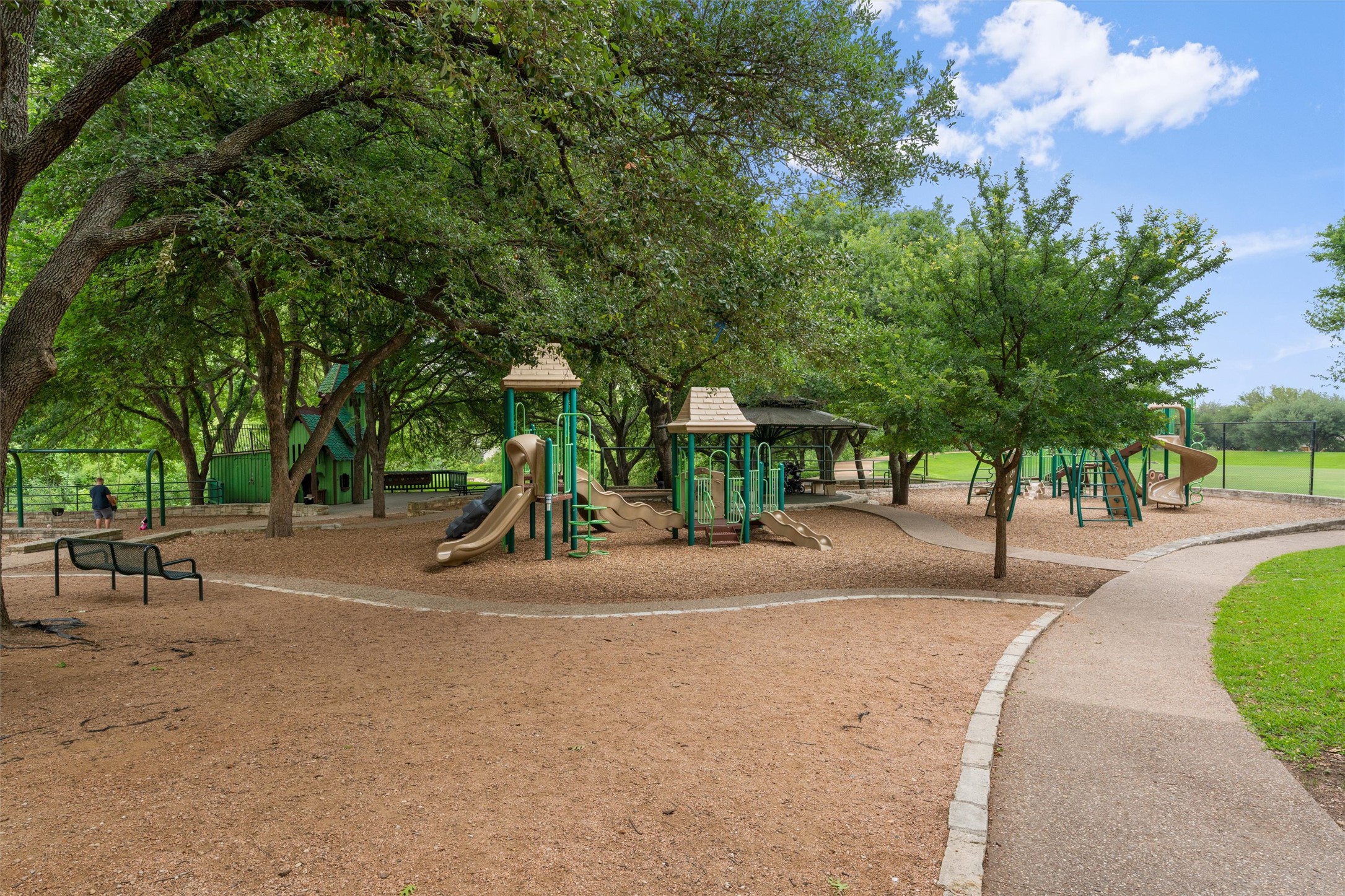 2010 Cervin Boulevard Austin, TX 78728 - Photo 28 of 32 a view of a park with swings and a trees