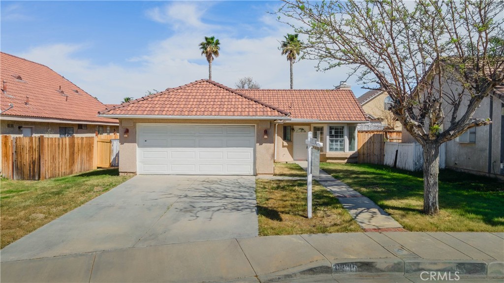 a front view of a house with yard