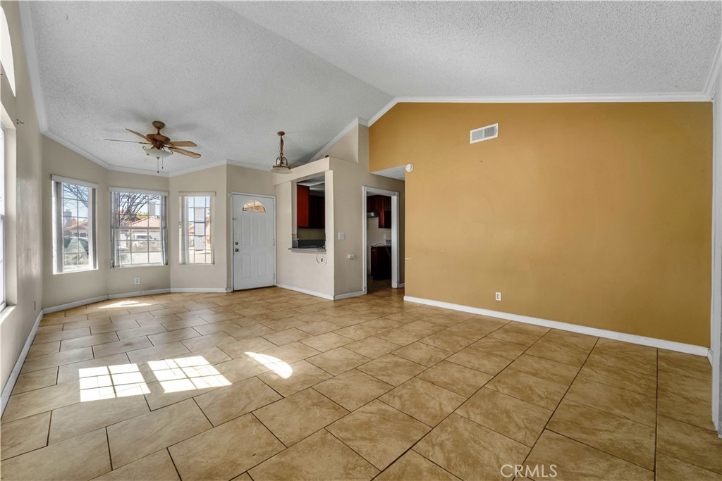 36806 Meadowview Court Palmdale, CA 93552 - Photo 5 of 17 a view of an empty room with windows