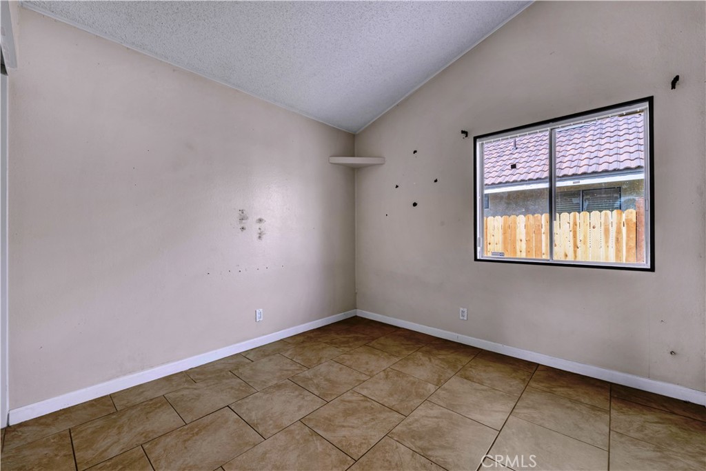 36806 Meadowview Court Palmdale, CA 93552 - Photo 9 of 17 an empty room with a window