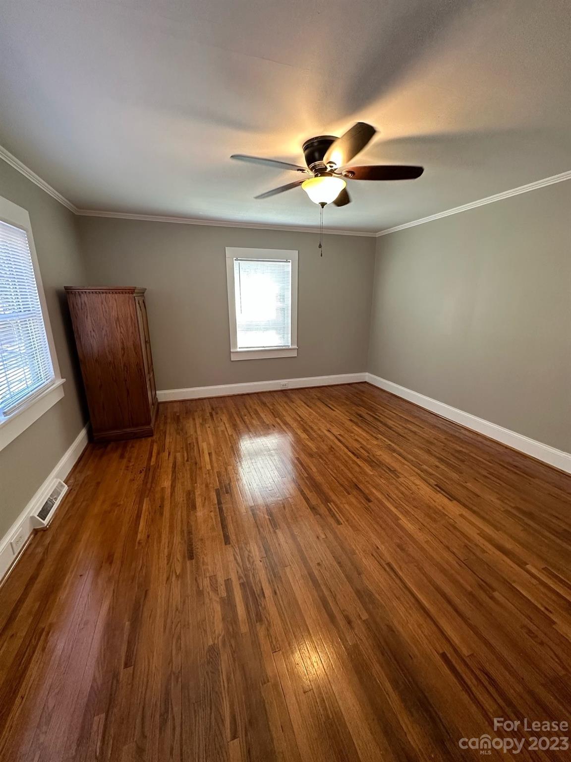 5650 Old Monroe Circle Concord, NC 28025 - Photo 3 of 11 a view of empty room with wooden floor and fan