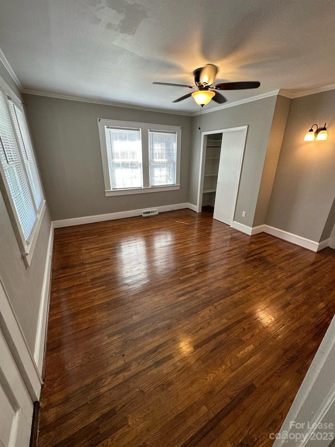 5650 Old Monroe Circle Concord, NC 28025 - Photo 5 of 11 a view of an empty room with wooden floor and a window