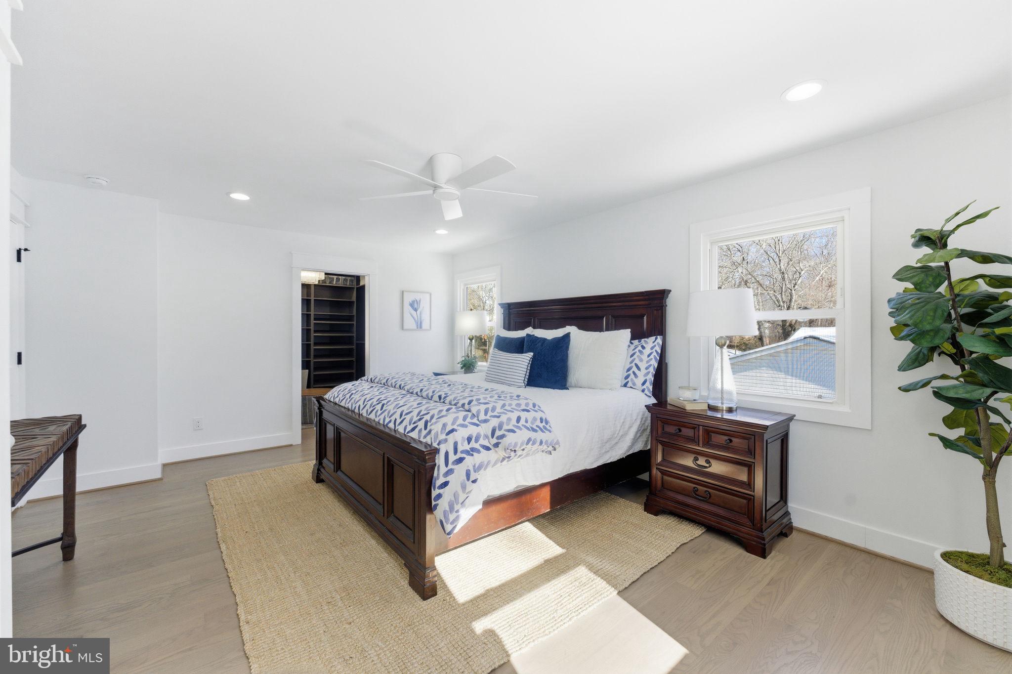 8615 Kerry Lane Springfield, VA 22152 - Photo 37 of 50 a bedroom with a bed and a potted plant