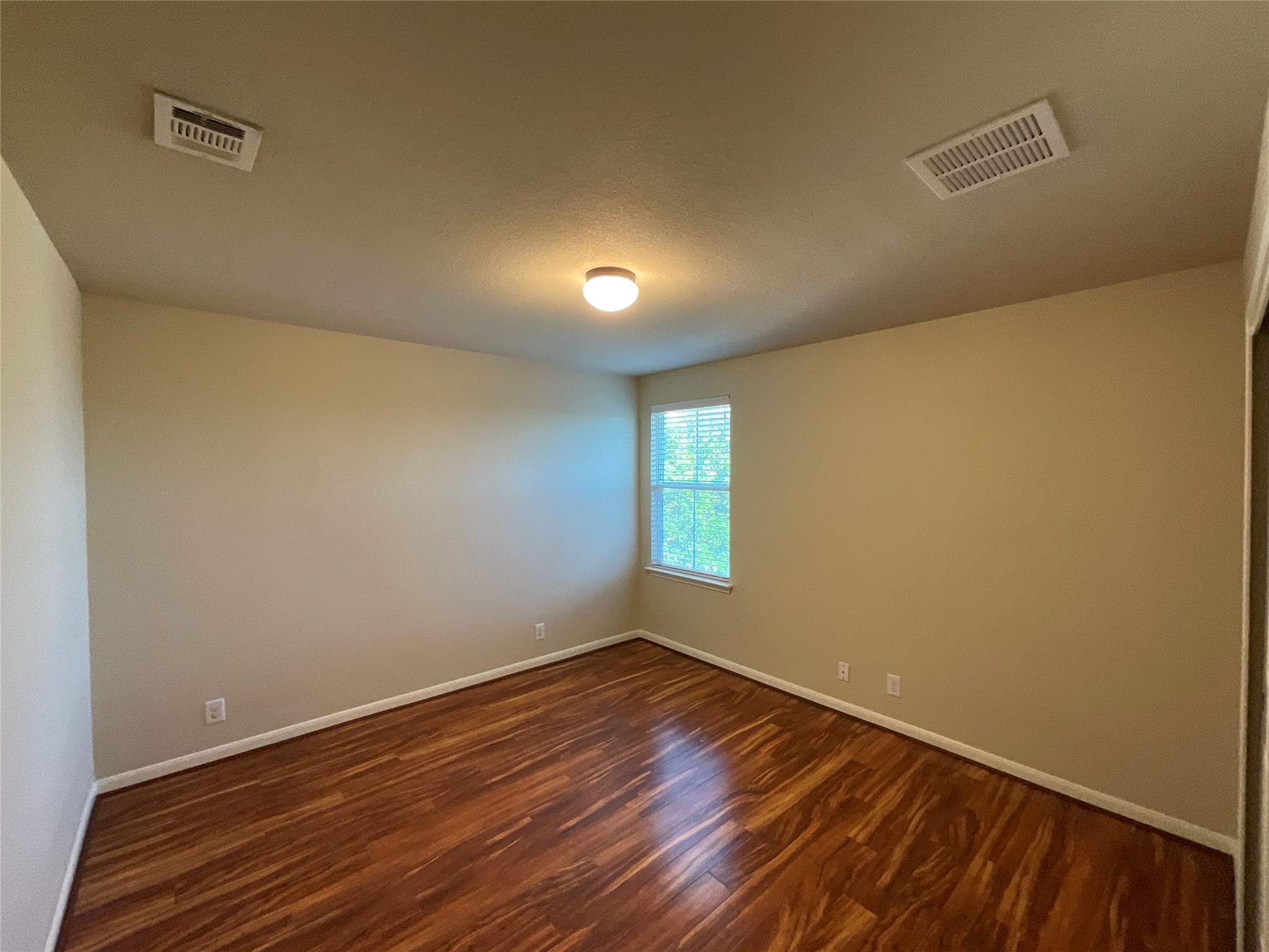 1911 Conn Creek Road Cedar Park, TX 78613 - Photo 25 of 39 a view of an empty room with wooden floor and a window