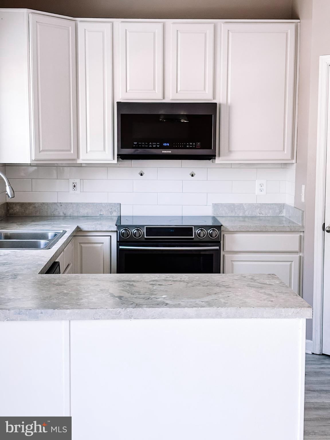 6151 Newton Lane Bealeton, VA 22712 - Photo 17 of 47 Modern kitchen with sleek finishes.