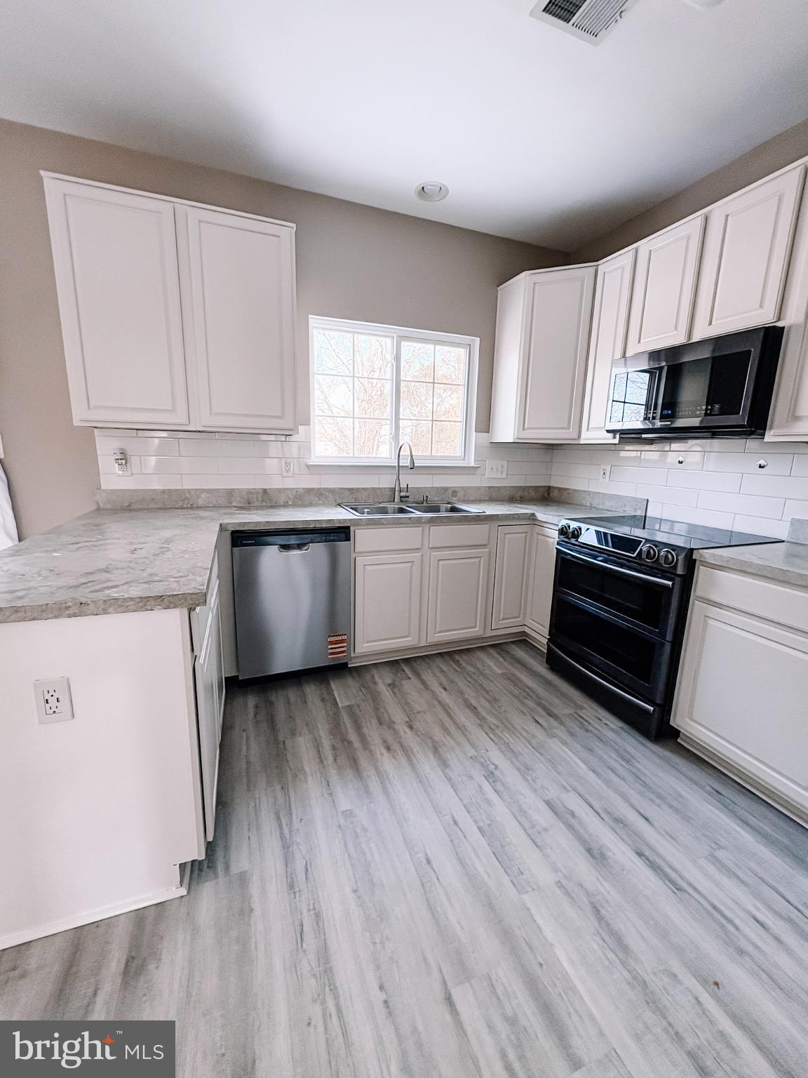 6151 Newton Lane Bealeton, VA 22712 - Photo 19 of 47 Modern kitchen with sleek finishes.