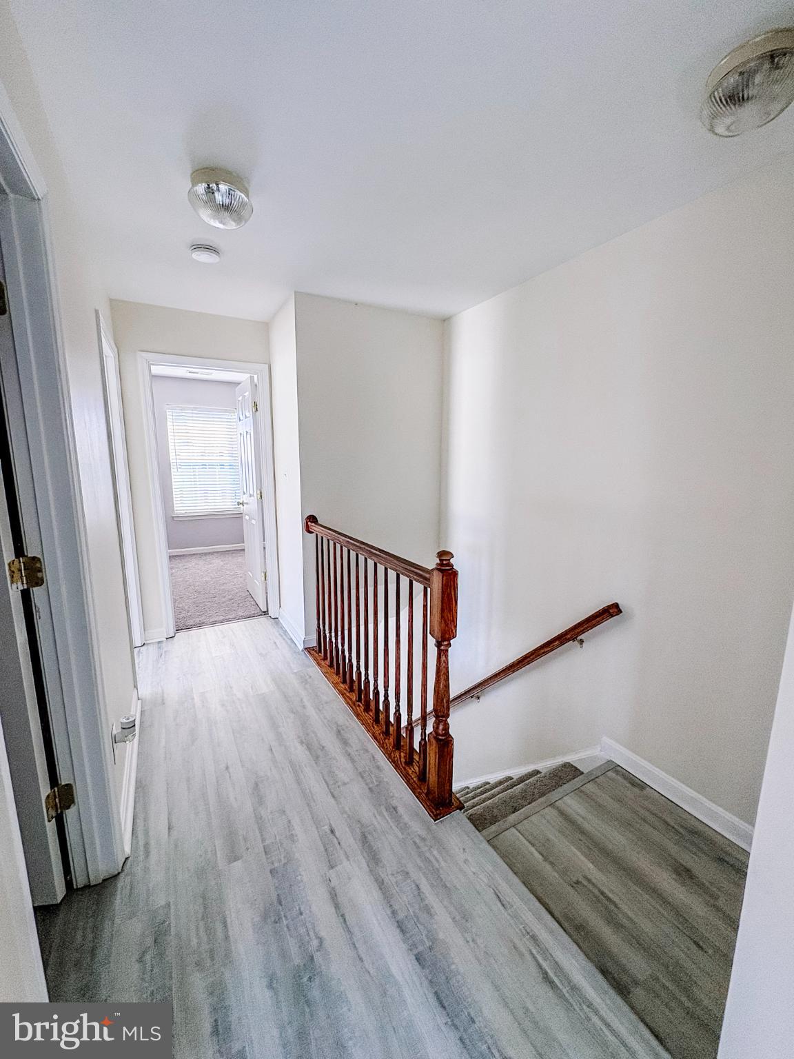 6151 Newton Lane Bealeton, VA 22712 - Photo 32 of 47 a view of a room with wooden floor and staircase