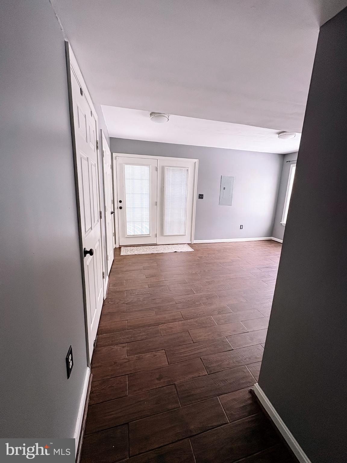 6151 Newton Lane Bealeton, VA 22712 - Photo 9 of 47 a view of a hallway with wooden floor and staircase