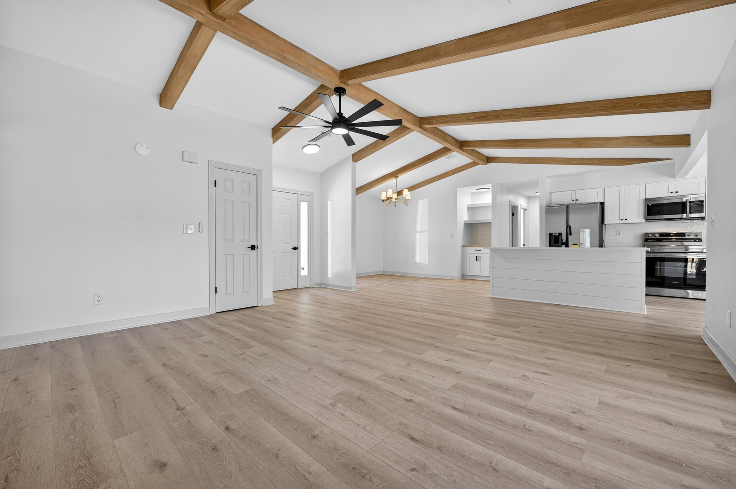 926 Ridgewood Way Niceville, FL 32578 - Photo 12 of 68 a view of a room with wooden floor and white walls