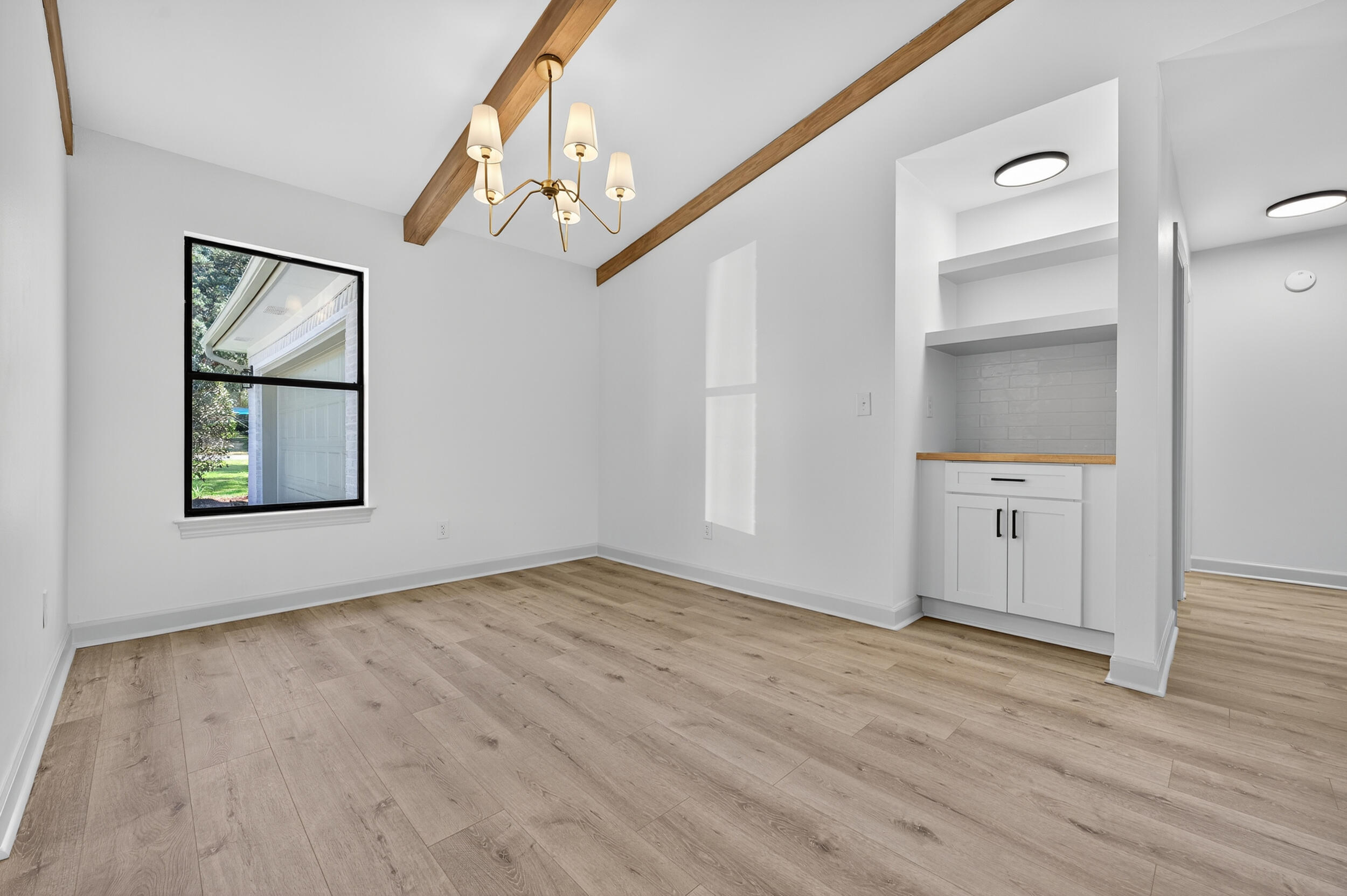 926 Ridgewood Way Niceville, FL 32578 - Photo 14 of 68 wooden floor in an empty room with a window
