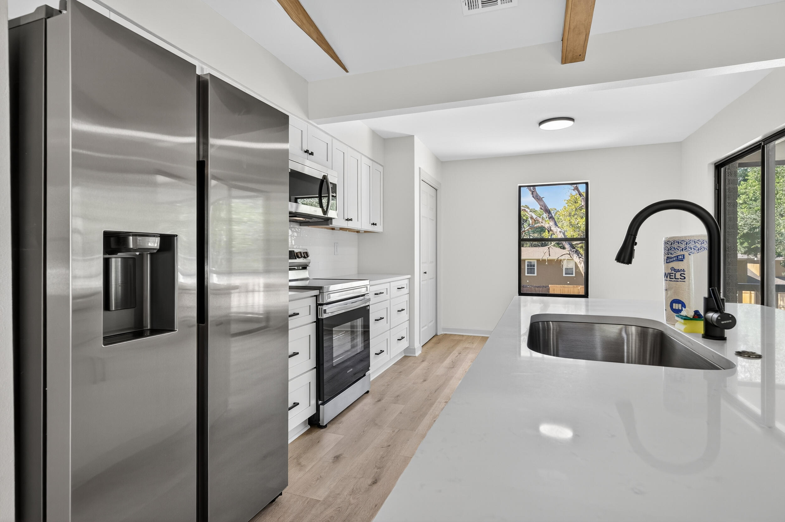 926 Ridgewood Way Niceville, FL 32578 - Photo 16 of 68 a kitchen with a refrigerator sink and stainless steel appliances