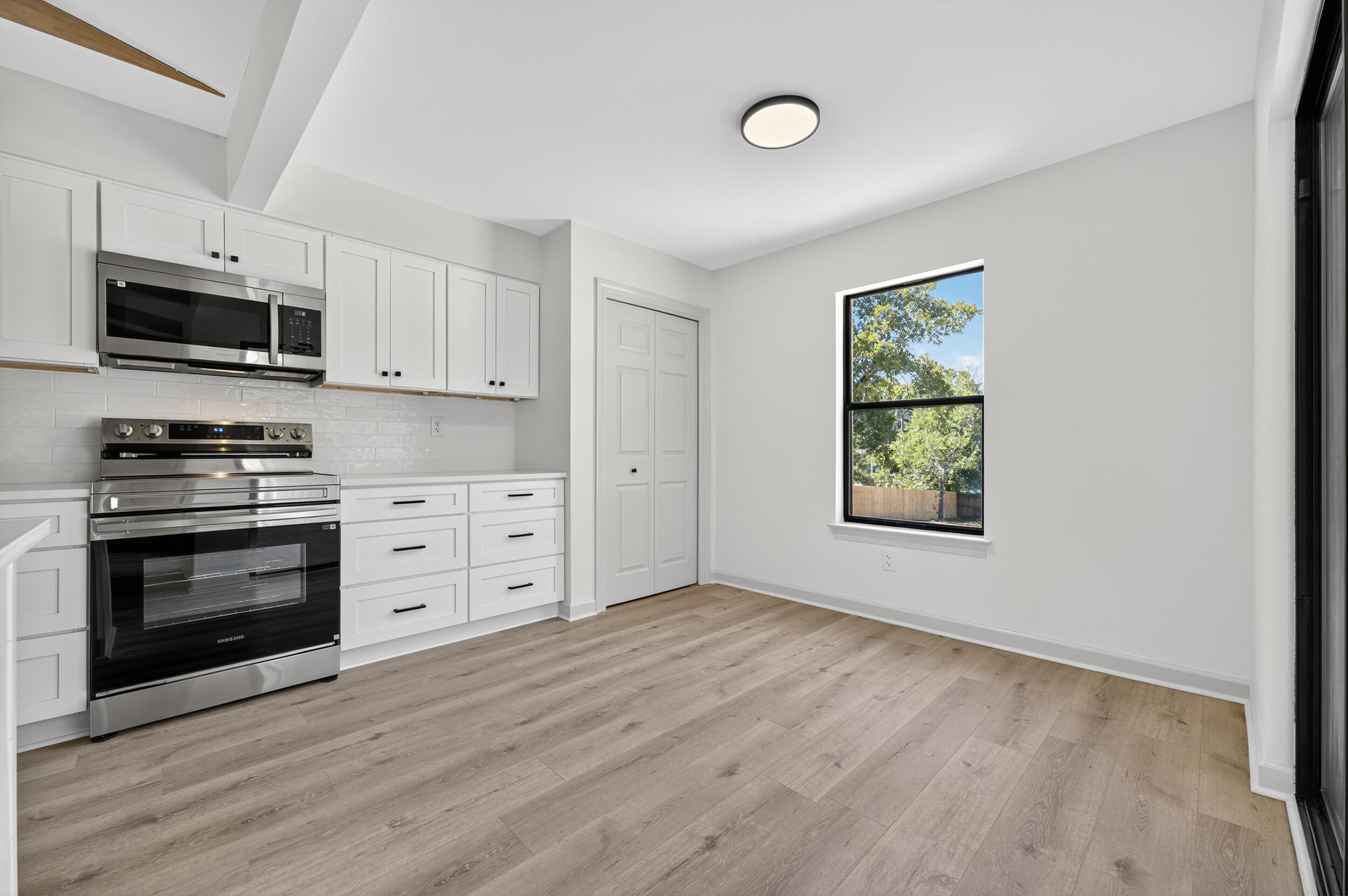 926 Ridgewood Way Niceville, FL 32578 - Photo 18 of 68 a kitchen with stainless steel appliances a stove top oven a sink and a microwave