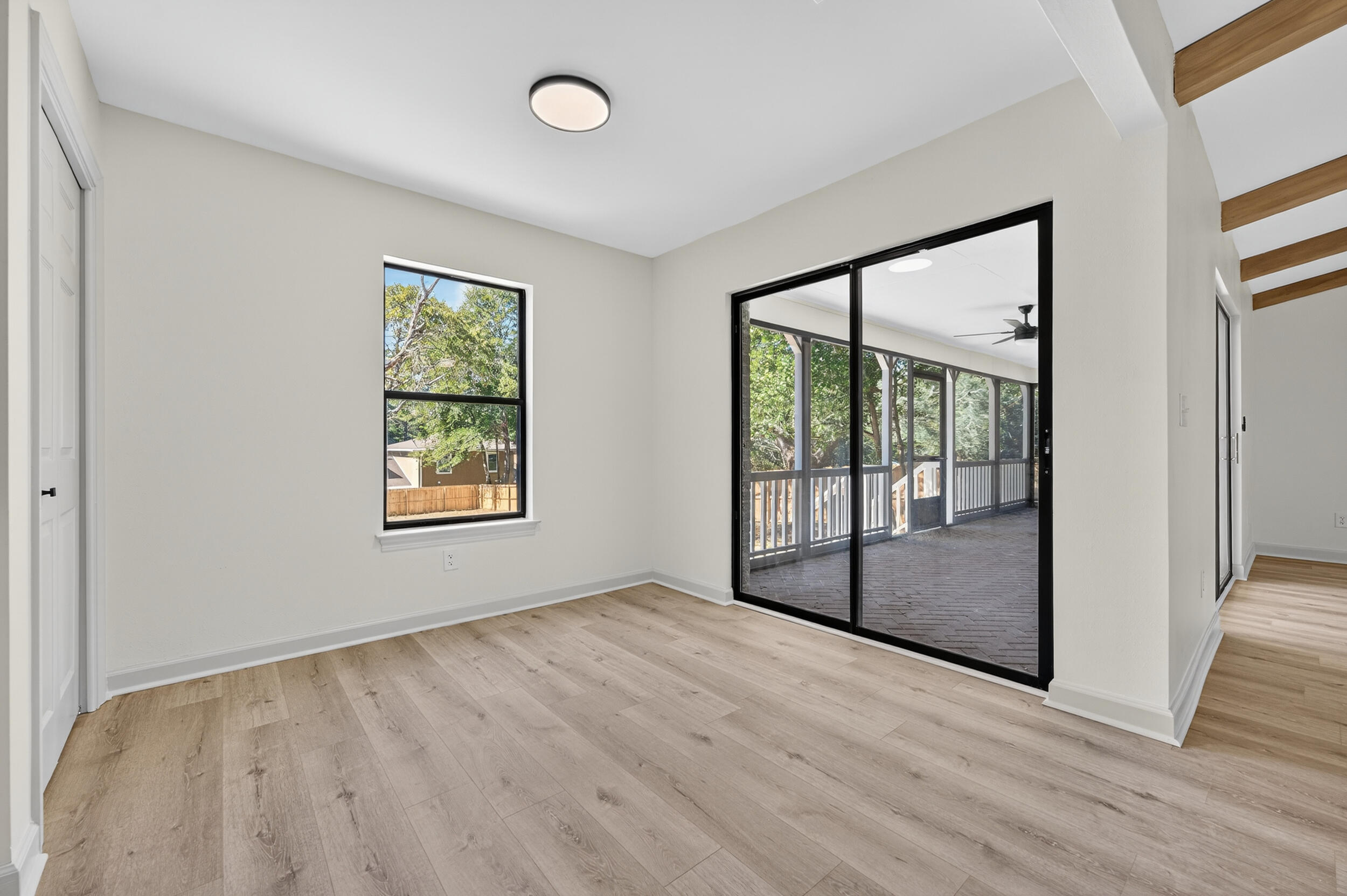 926 Ridgewood Way Niceville, FL 32578 - Photo 19 of 68 an empty room with wooden floor and windows