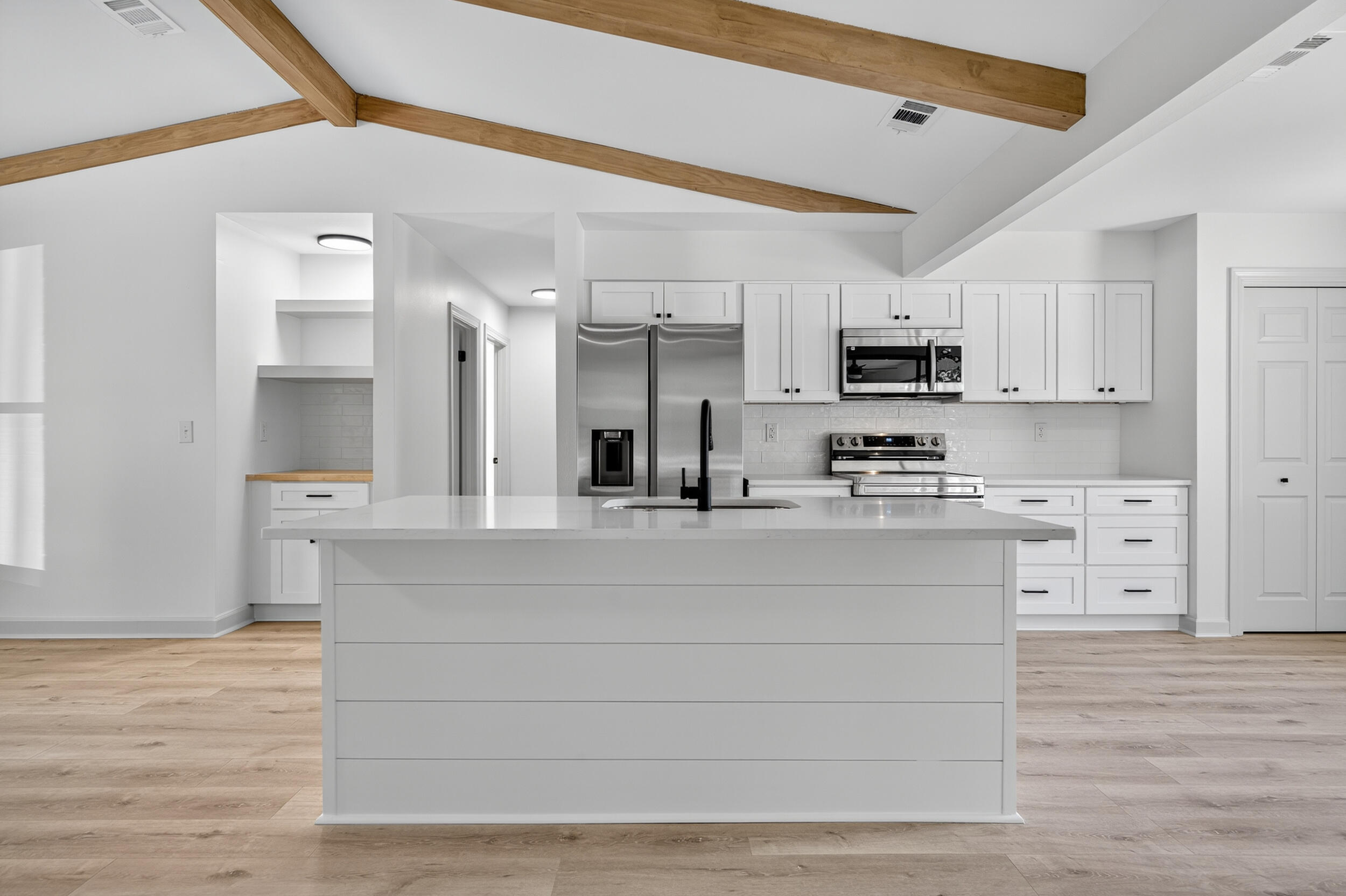 926 Ridgewood Way Niceville, FL 32578 - Photo 21 of 68 a kitchen with kitchen island a sink and a stove top oven