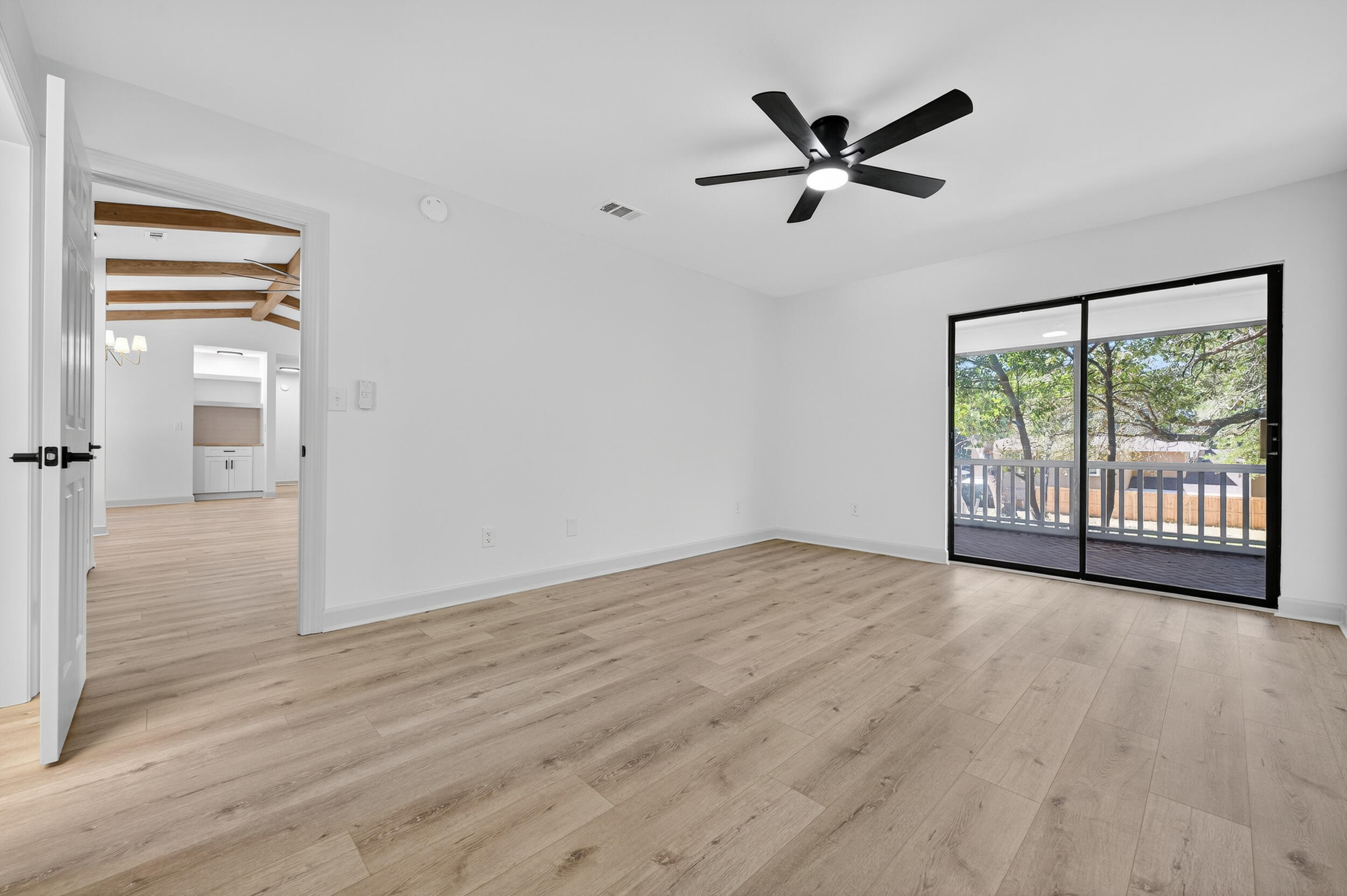 926 Ridgewood Way Niceville, FL 32578 - Photo 22 of 68 wooden floor in an empty room with a window