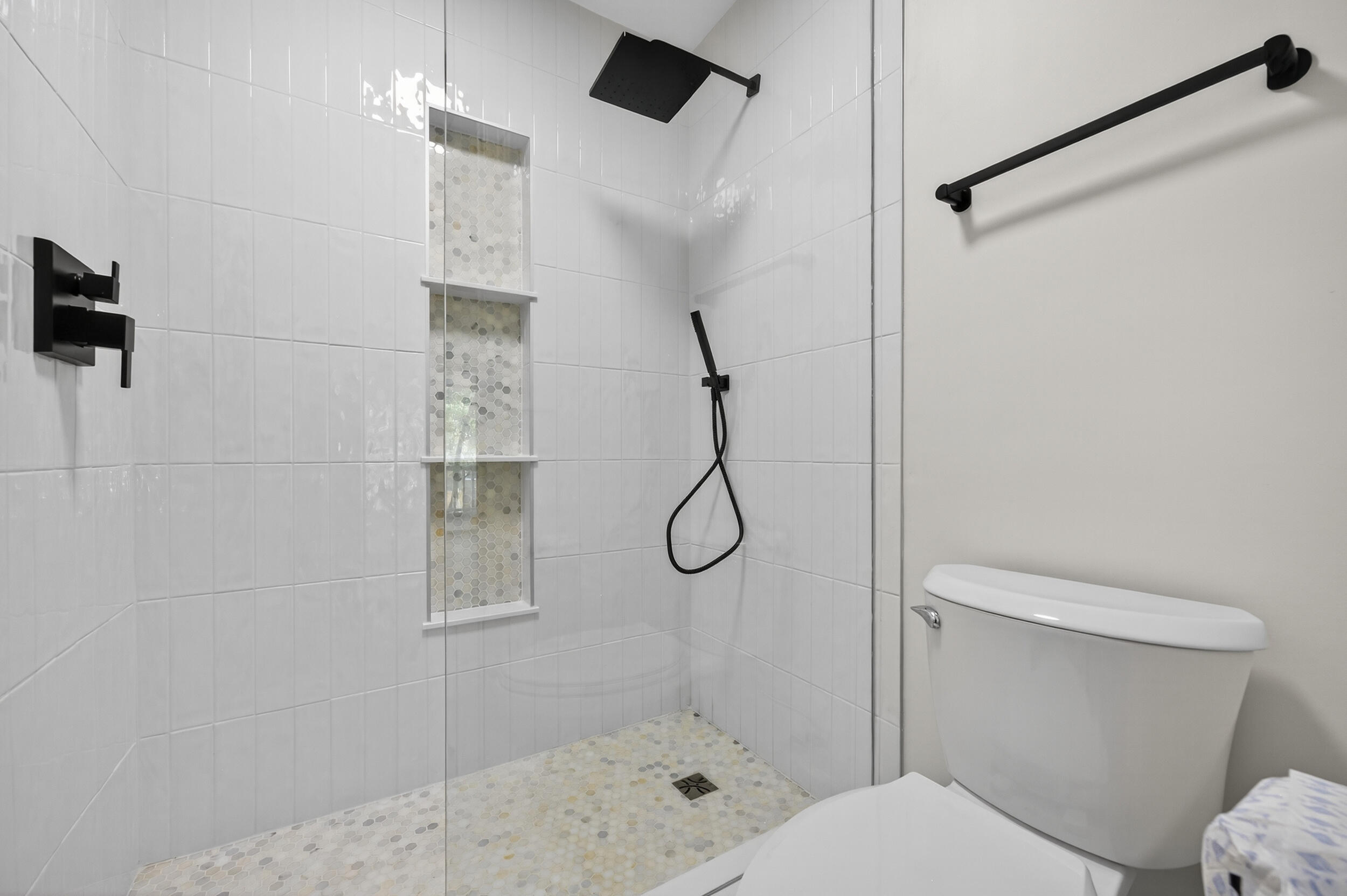 926 Ridgewood Way Niceville, FL 32578 - Photo 24 of 68 a bathroom with a glass shower door