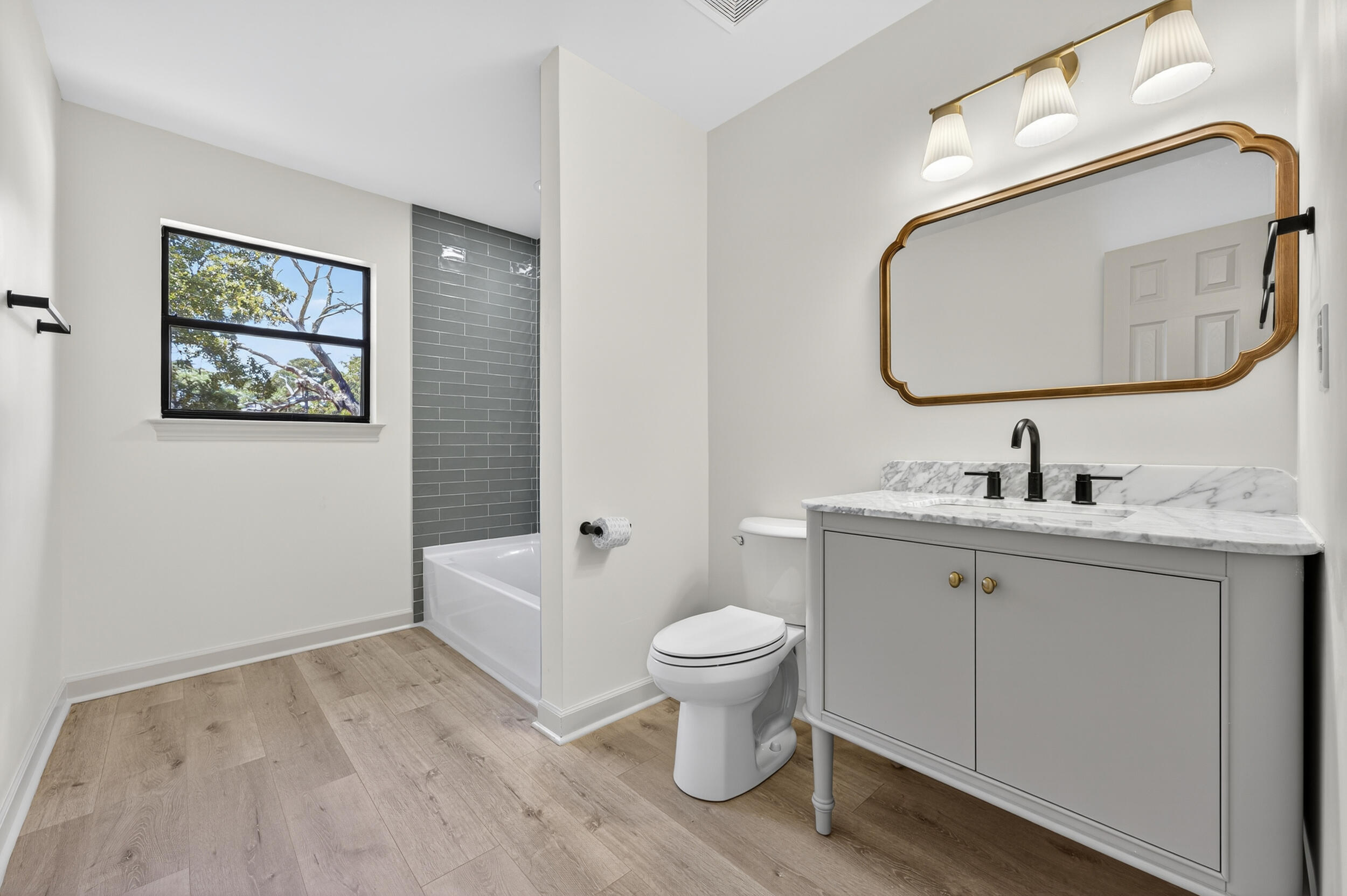 926 Ridgewood Way Niceville, FL 32578 - Photo 33 of 68 a bathroom with a toilet sink and mirror