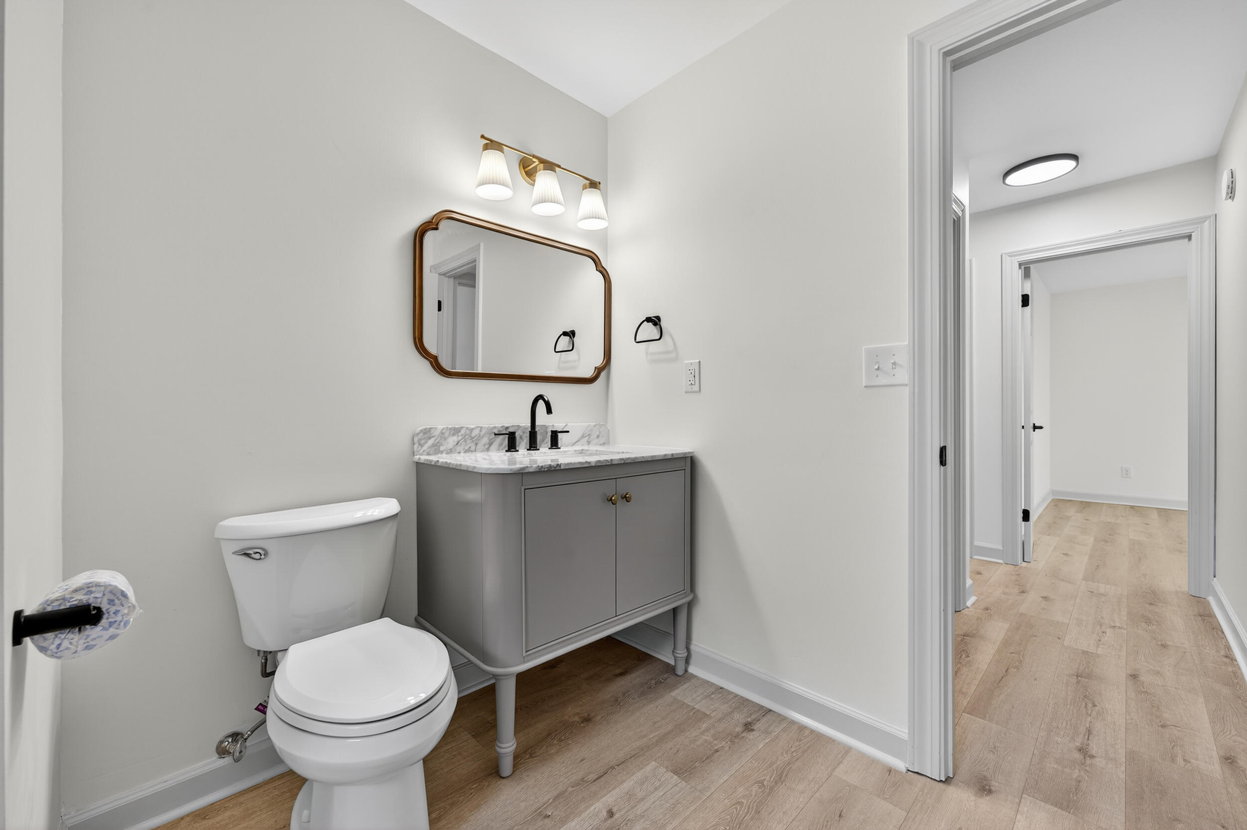 926 Ridgewood Way Niceville, FL 32578 - Photo 35 of 68 a bathroom with a toilet sink and mirror