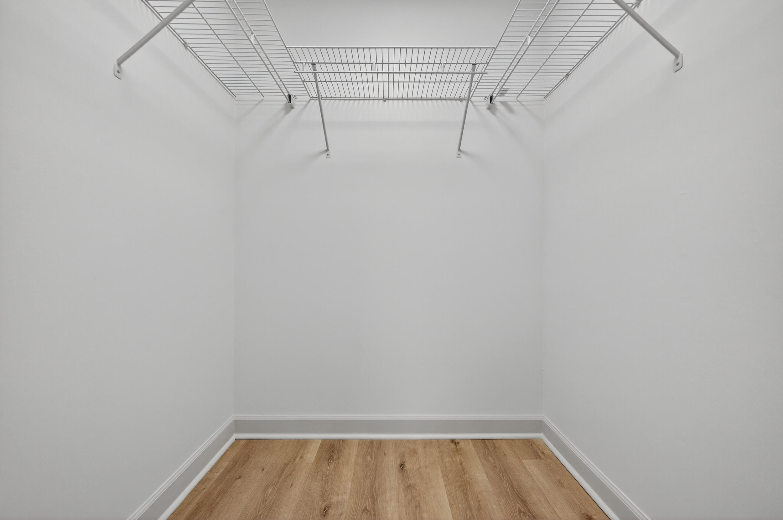 926 Ridgewood Way Niceville, FL 32578 - Photo 39 of 68 a view of walk in closet with racks on the wall