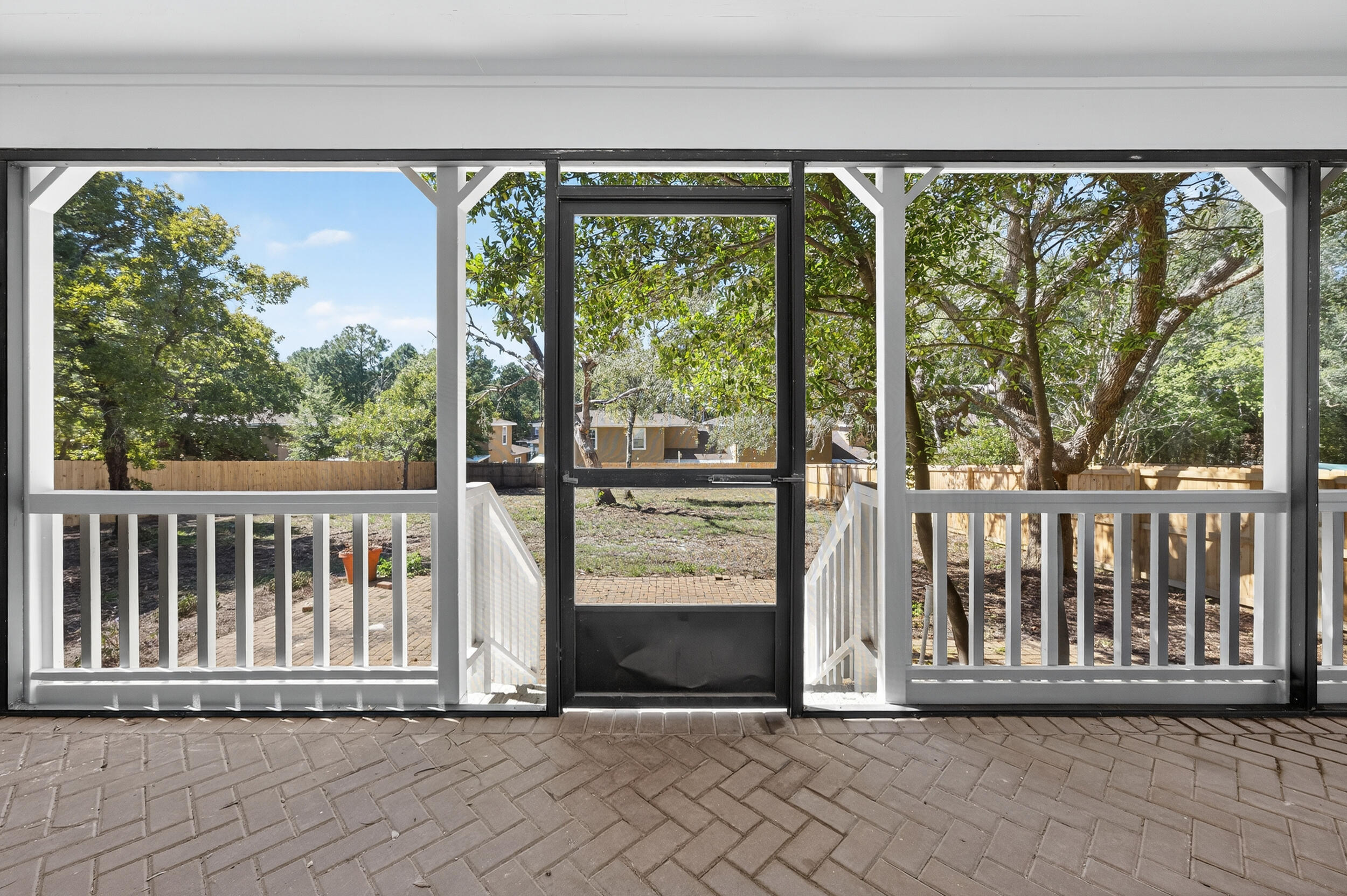 926 Ridgewood Way Niceville, FL 32578 - Photo 50 of 68 a view of a porch with a floor to ceiling window