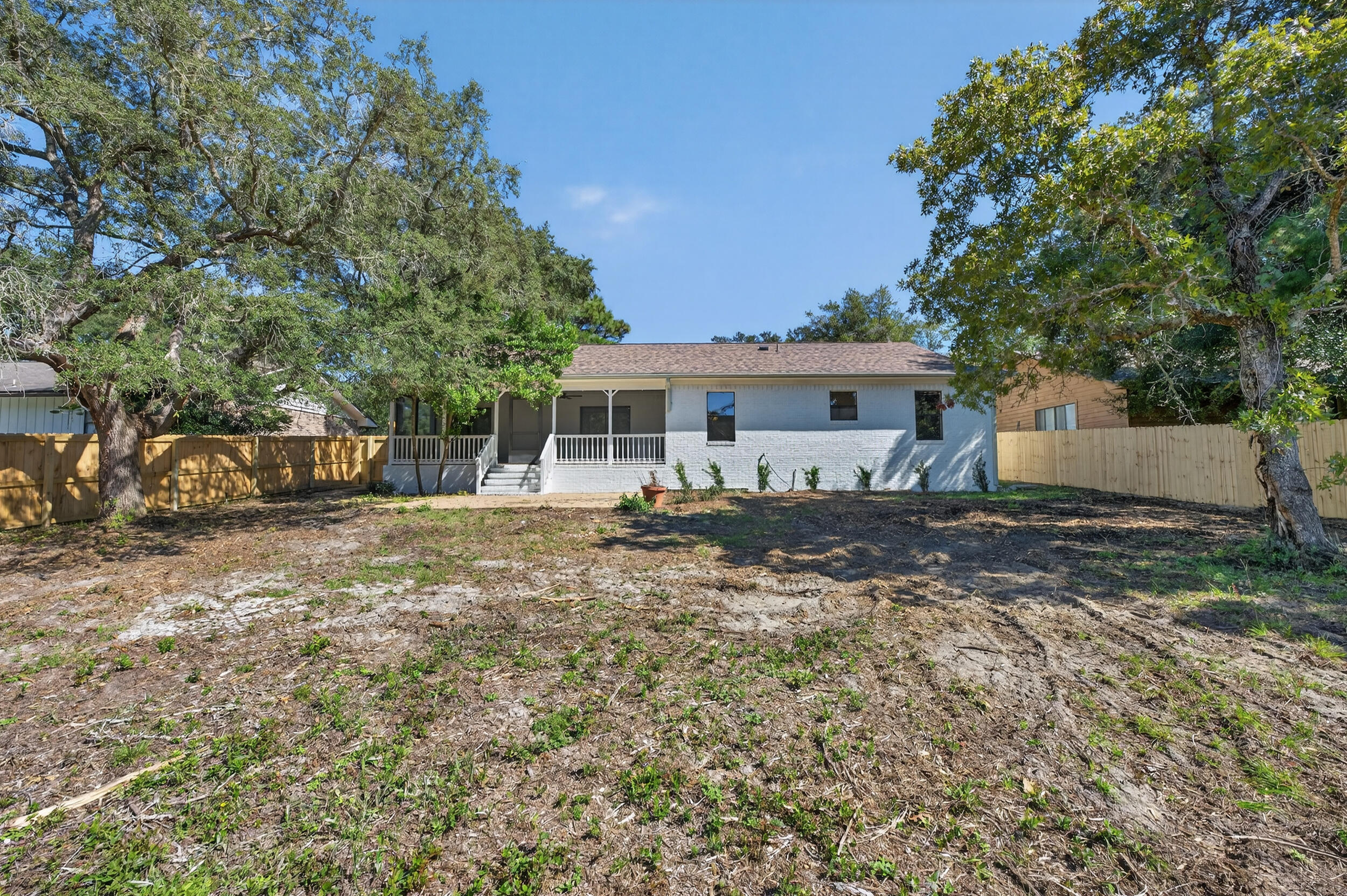 926 Ridgewood Way Niceville, FL 32578 - Photo 56 of 68 a front view of a house with a yard
