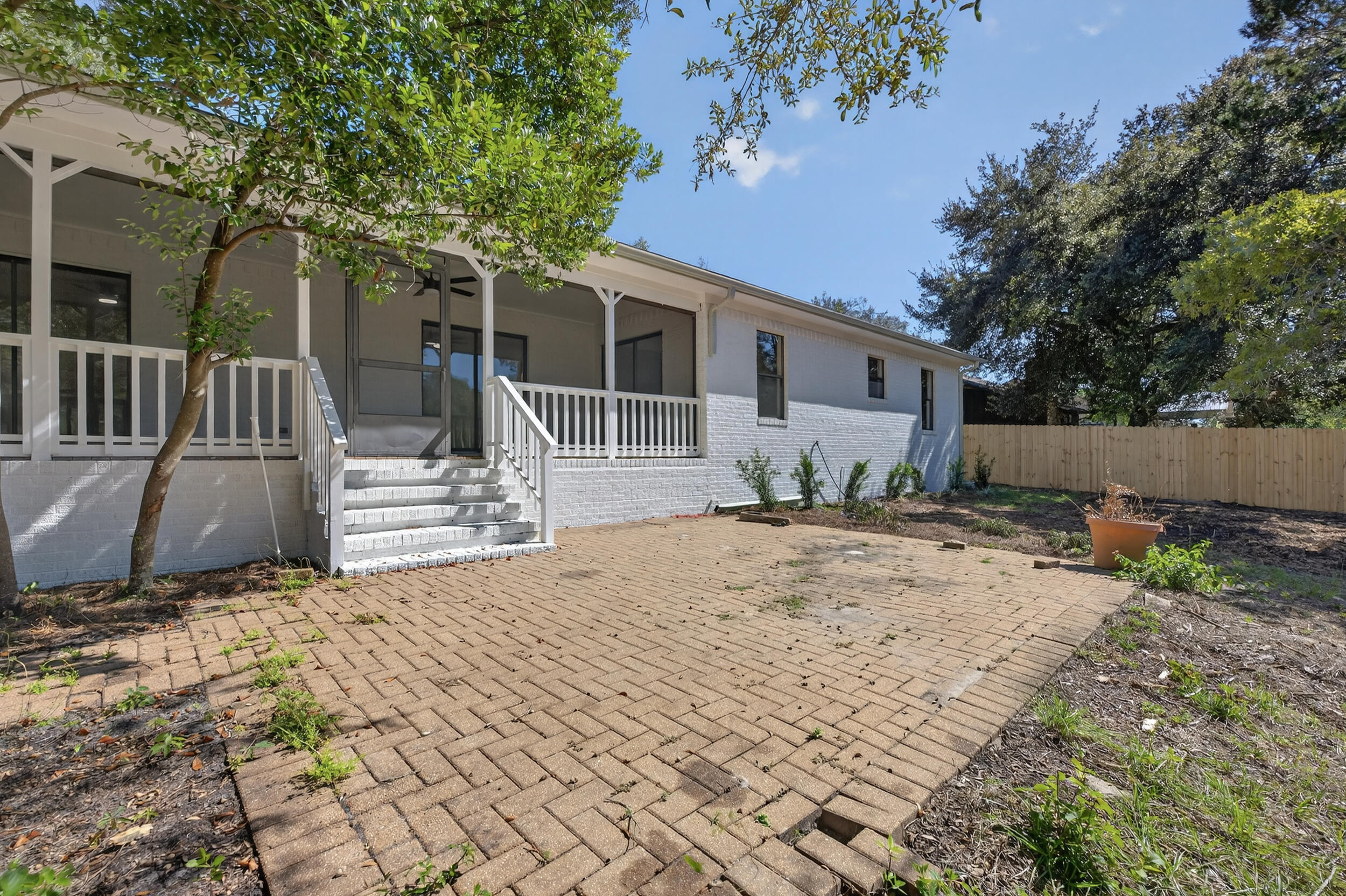 926 Ridgewood Way Niceville, FL 32578 - Photo 57 of 68 a view of a house with backyard and a tree