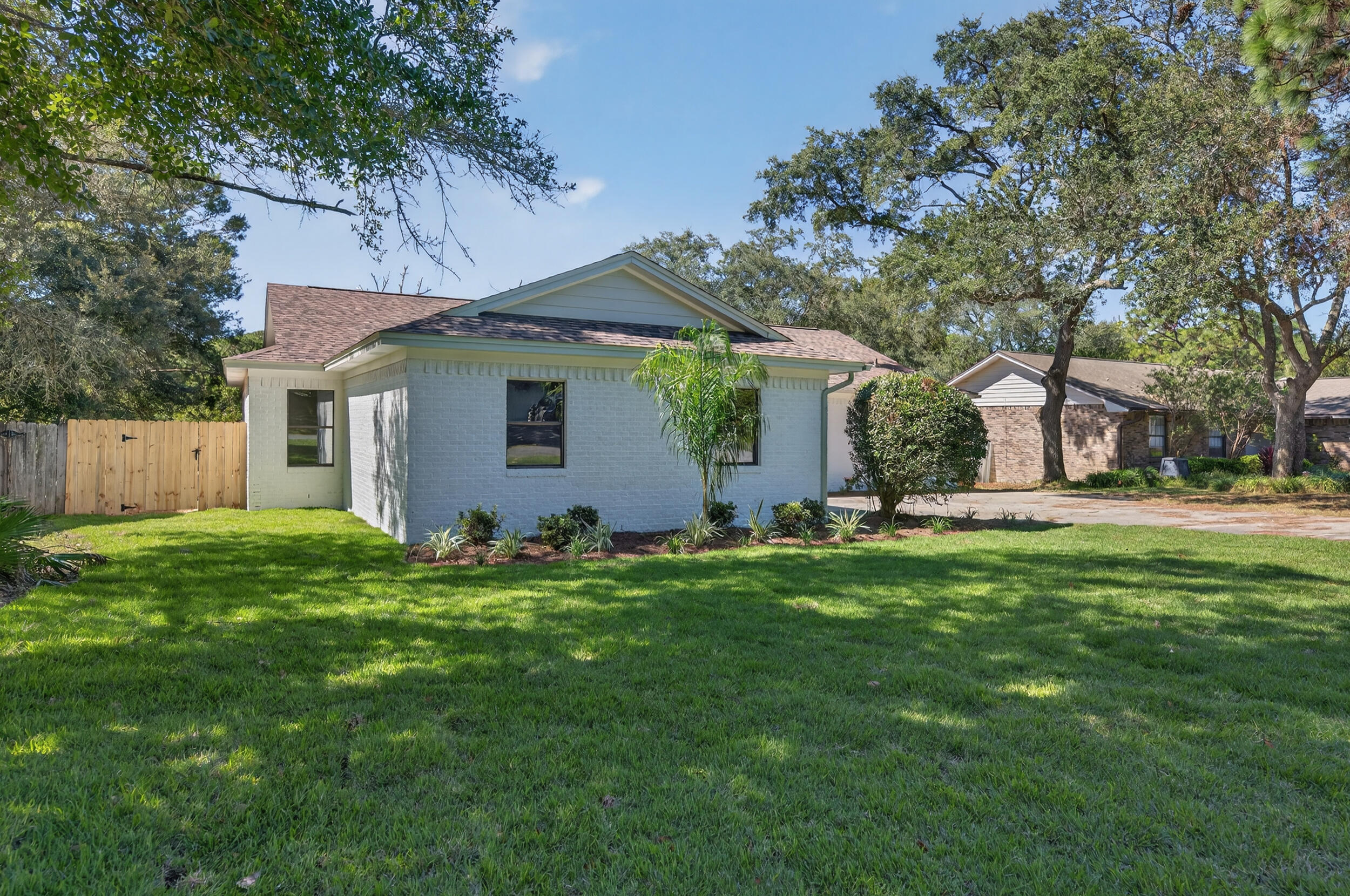 926 Ridgewood Way Niceville, FL 32578 - Photo 8 of 68 a front view of house with yard and green space