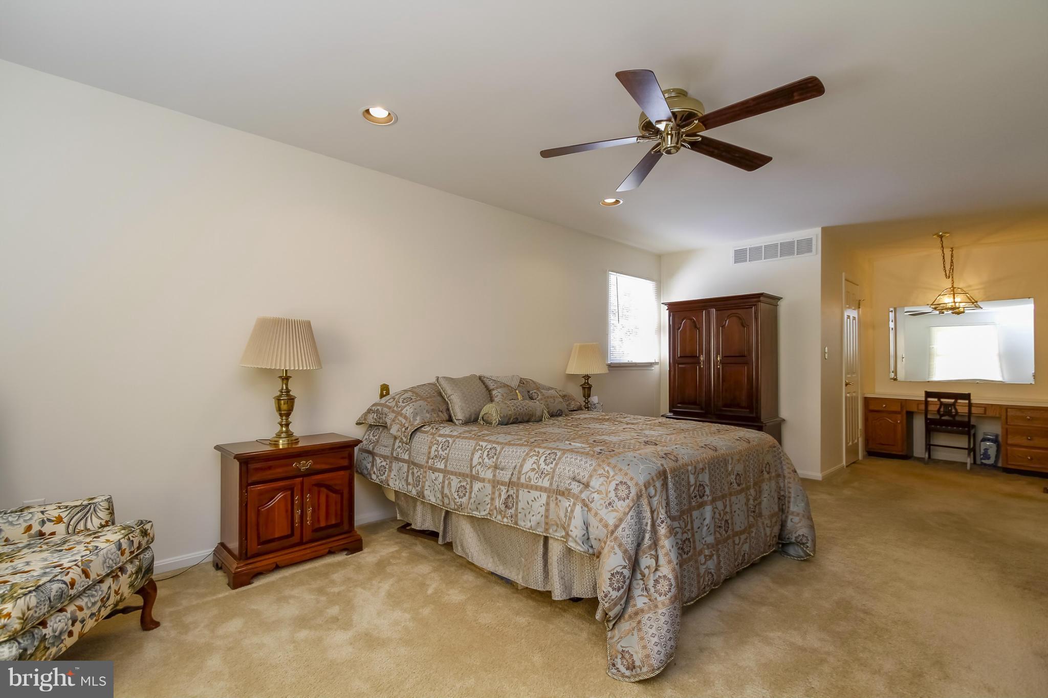 14015 Foxland Road Phoenix, MD 21131 - Photo 13 of 24 a bedroom with a bed and a ceiling fan