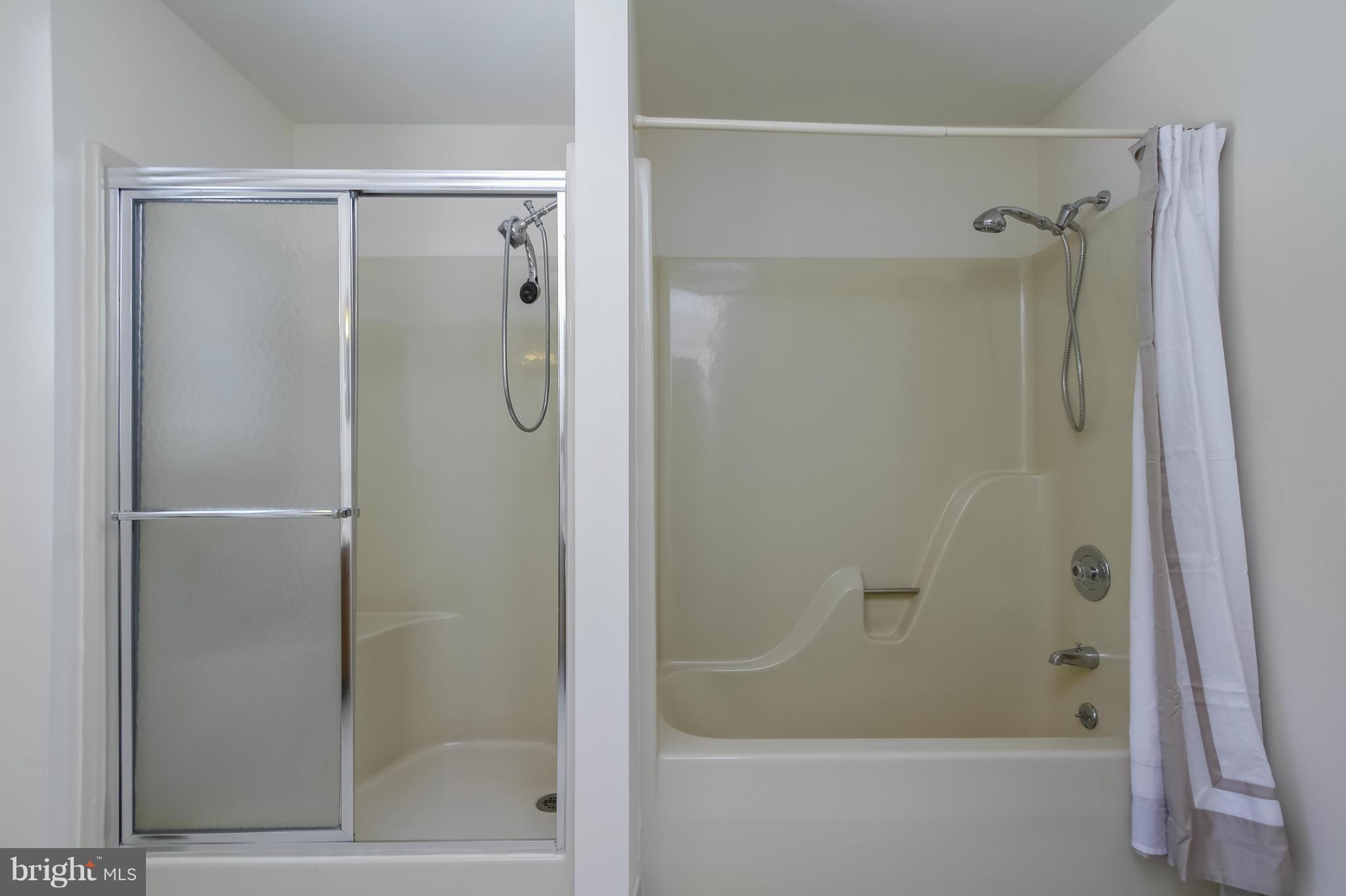 14015 Foxland Road Phoenix, MD 21131 - Photo 15 of 24 a bathroom with a glass shower door