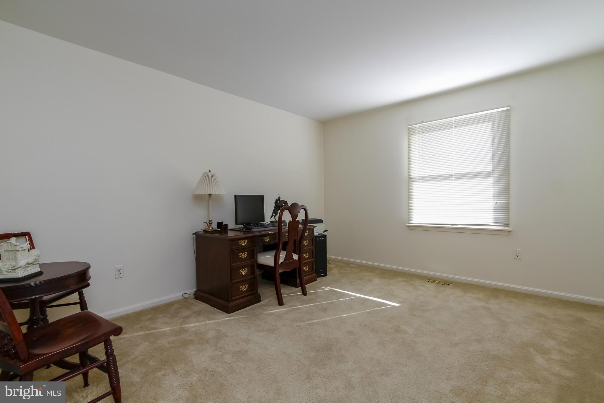 14015 Foxland Road Phoenix, MD 21131 - Photo 16 of 24 a living room with furniture and a window