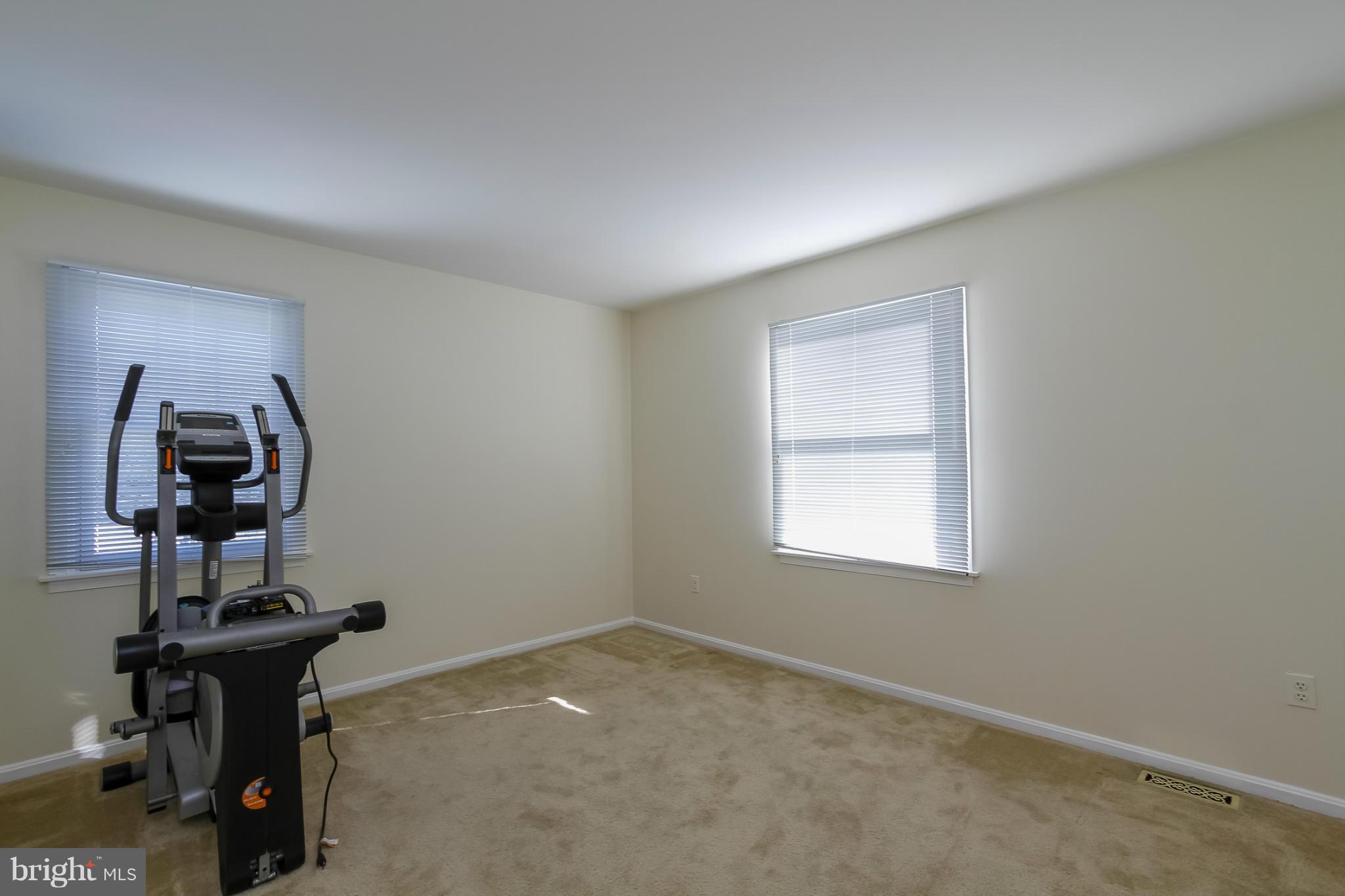 14015 Foxland Road Phoenix, MD 21131 - Photo 17 of 24 a view of a room with a window and gym cycle