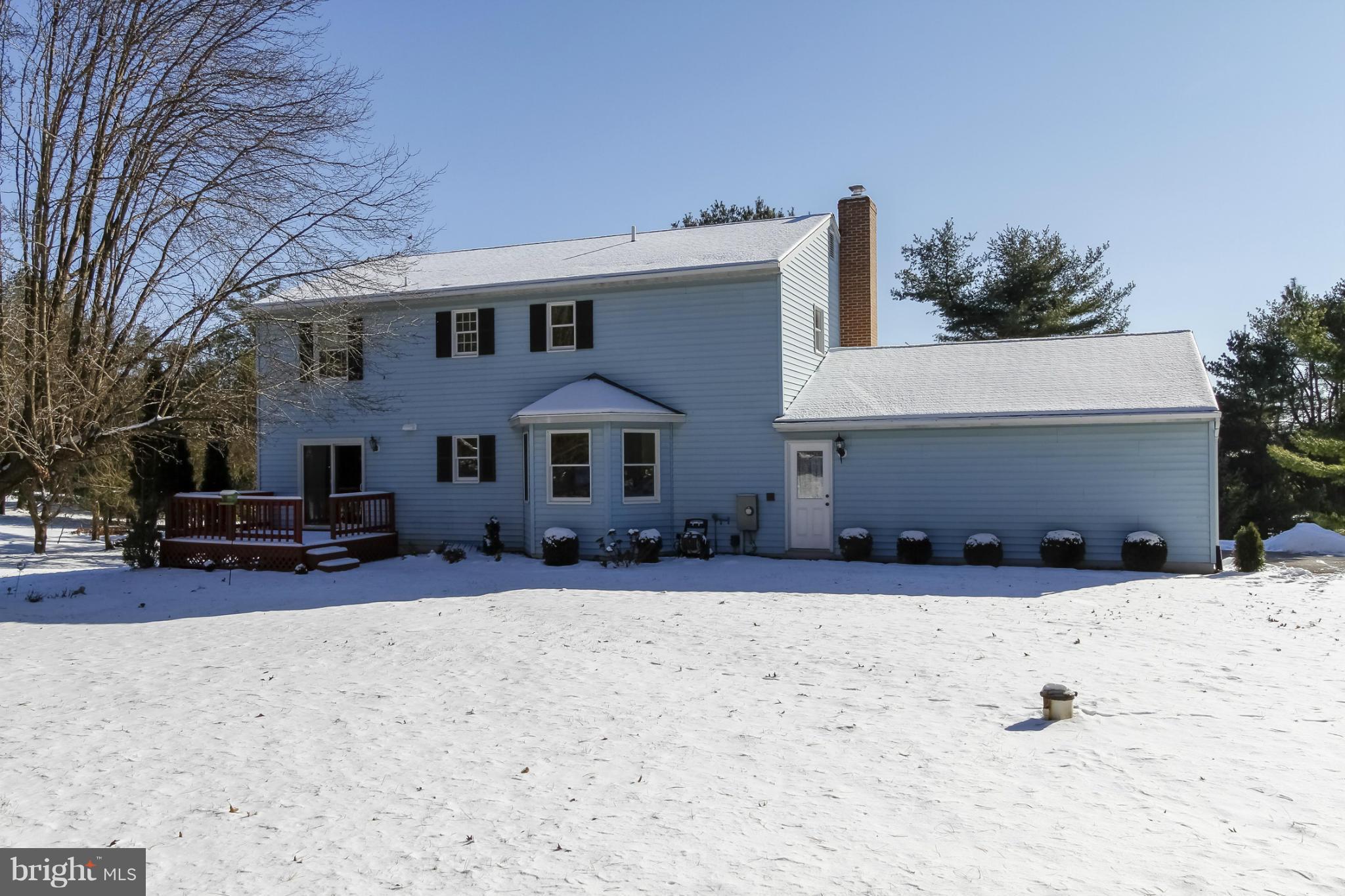 14015 Foxland Road Phoenix, MD 21131 - Photo 24 of 24 a front view of a house with a yard covered in snow