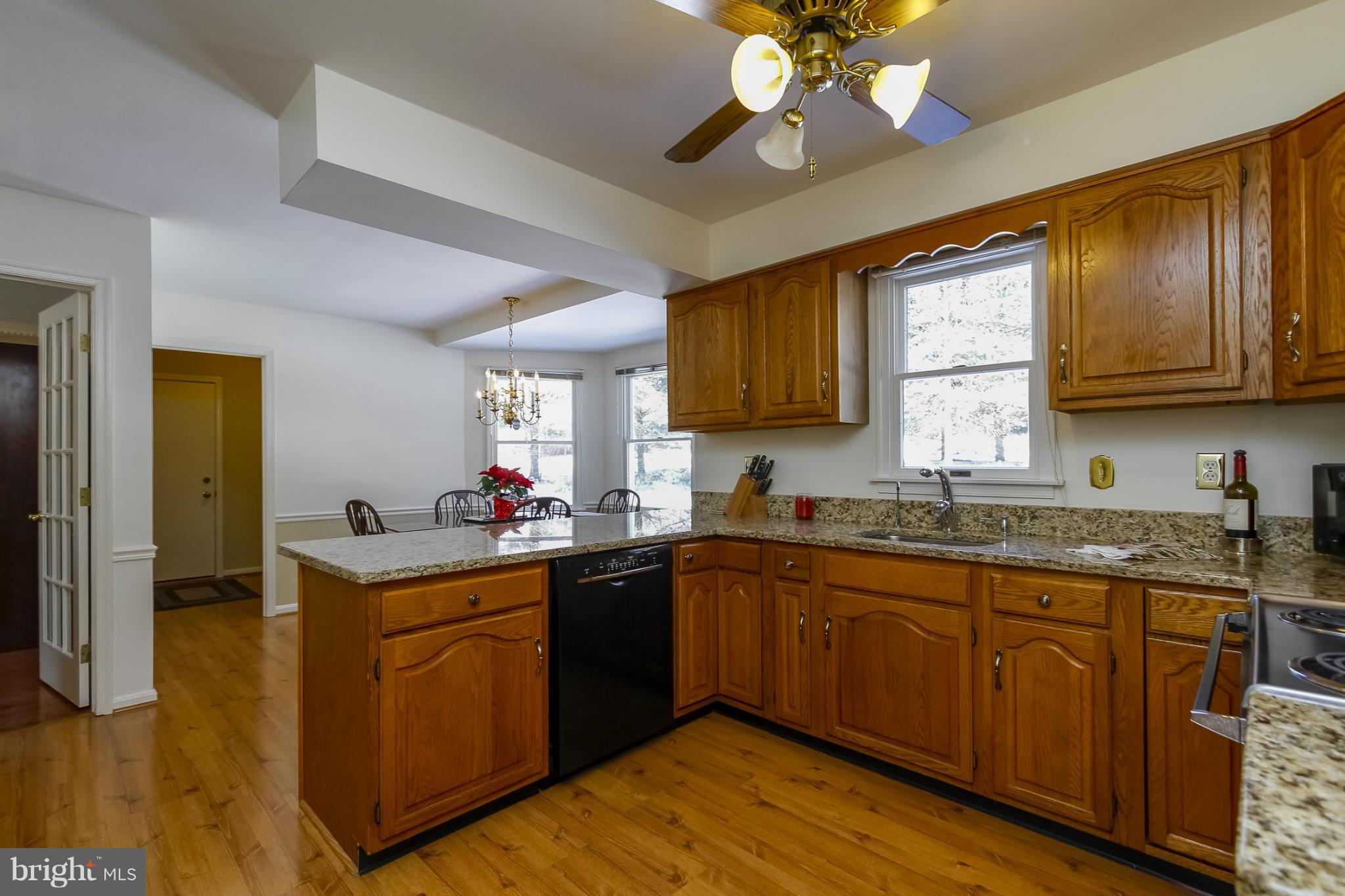 14015 Foxland Road Phoenix, MD 21131 - Photo 6 of 24 a kitchen with a sink cabinets and window