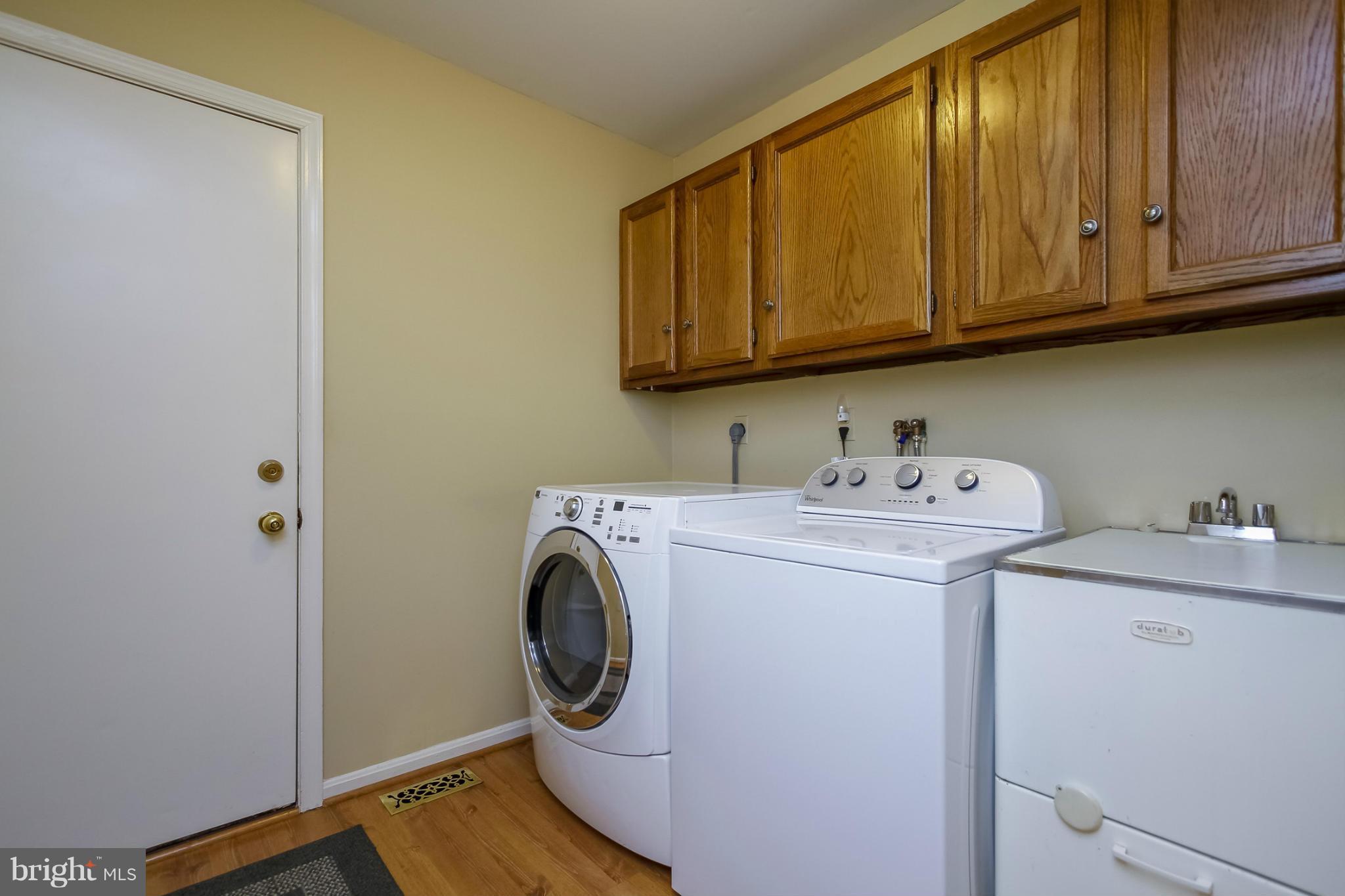 14015 Foxland Road Phoenix, MD 21131 - Photo 10 of 24 a utility room with dryer and washer