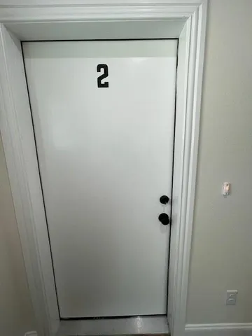 a bathroom with a glass door