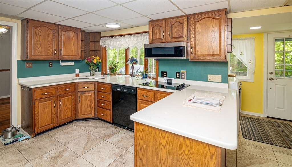 300 Mason Rd Extension Dudley, MA 01571 - Photo 11 of 42 a kitchen with stainless steel appliances granite countertop a sink a stove and refrigerator