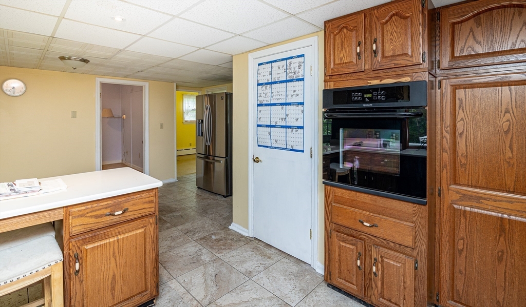 300 Mason Rd Extension Dudley, MA 01571 - Photo 14 of 42 a kitchen with stainless steel appliances a refrigerator and cabinets
