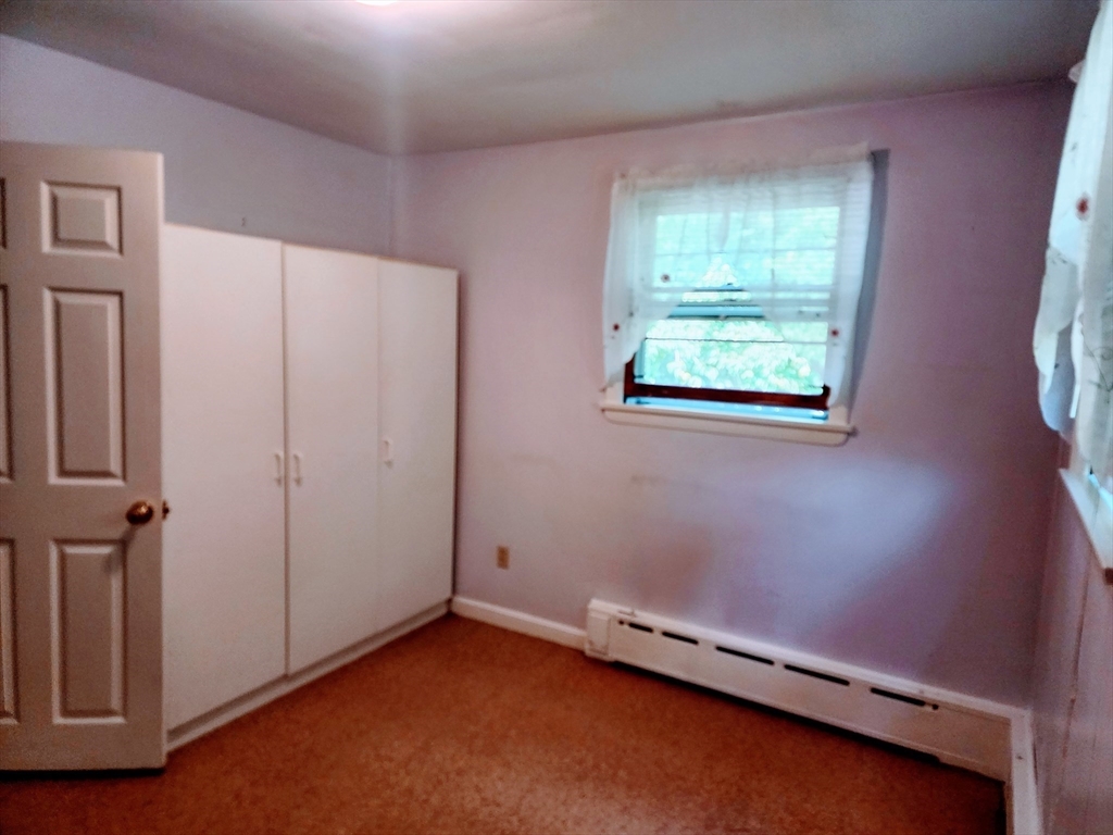 300 Mason Rd Extension Dudley, MA 01571 - Photo 19 of 42 an empty room with windows