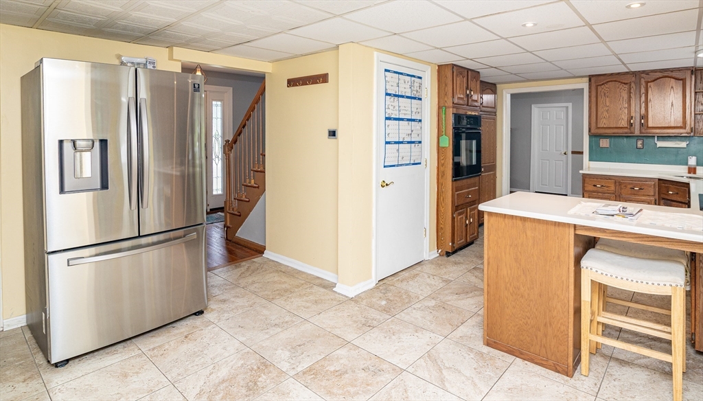 300 Mason Rd Extension Dudley, MA 01571 - Photo 3 of 42 a kitchen with stainless steel appliances a refrigerator and a stove